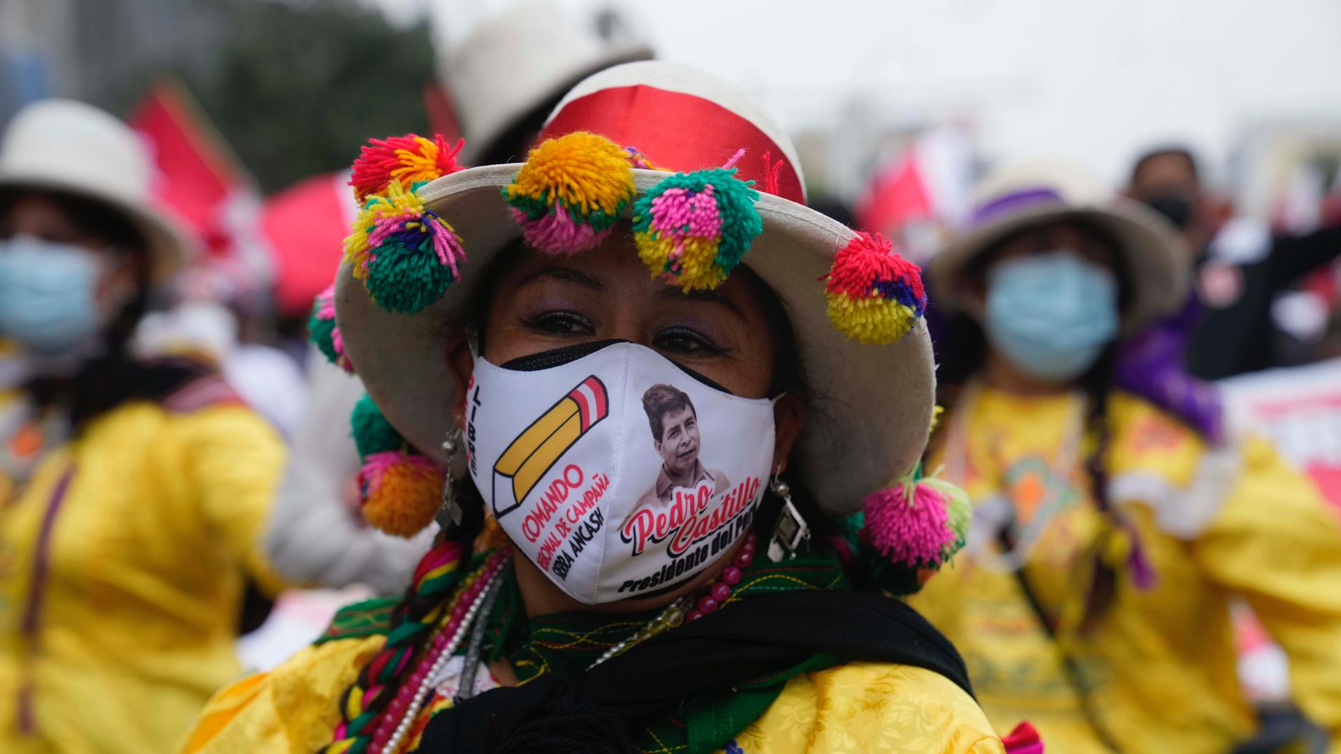 People march in support of presidential candidate Pedro Castillo weeks after the presidential runoff election, in Lima, Peru, June 26, 2021. With all the votes tallied from the June 6th presidential runoff, Castillo is ahead of his rival candidate Keiko F