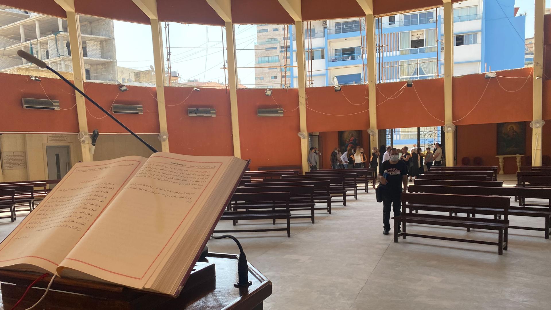 In a church about a mile from Beirut’s port, Sunday mass occurs with just a few dozen worshipers in the massive hall.