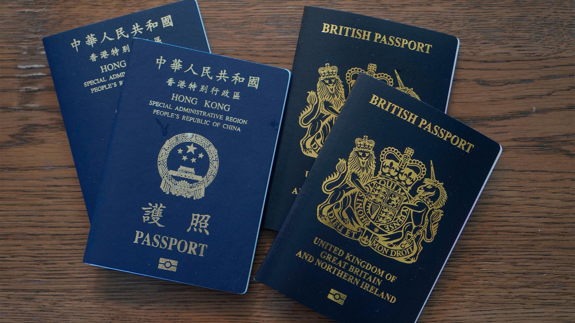 Blue British National Overseas passports (BNO) and Hong Kong Special Administrative Region of the People's Republic of China passports are displayed