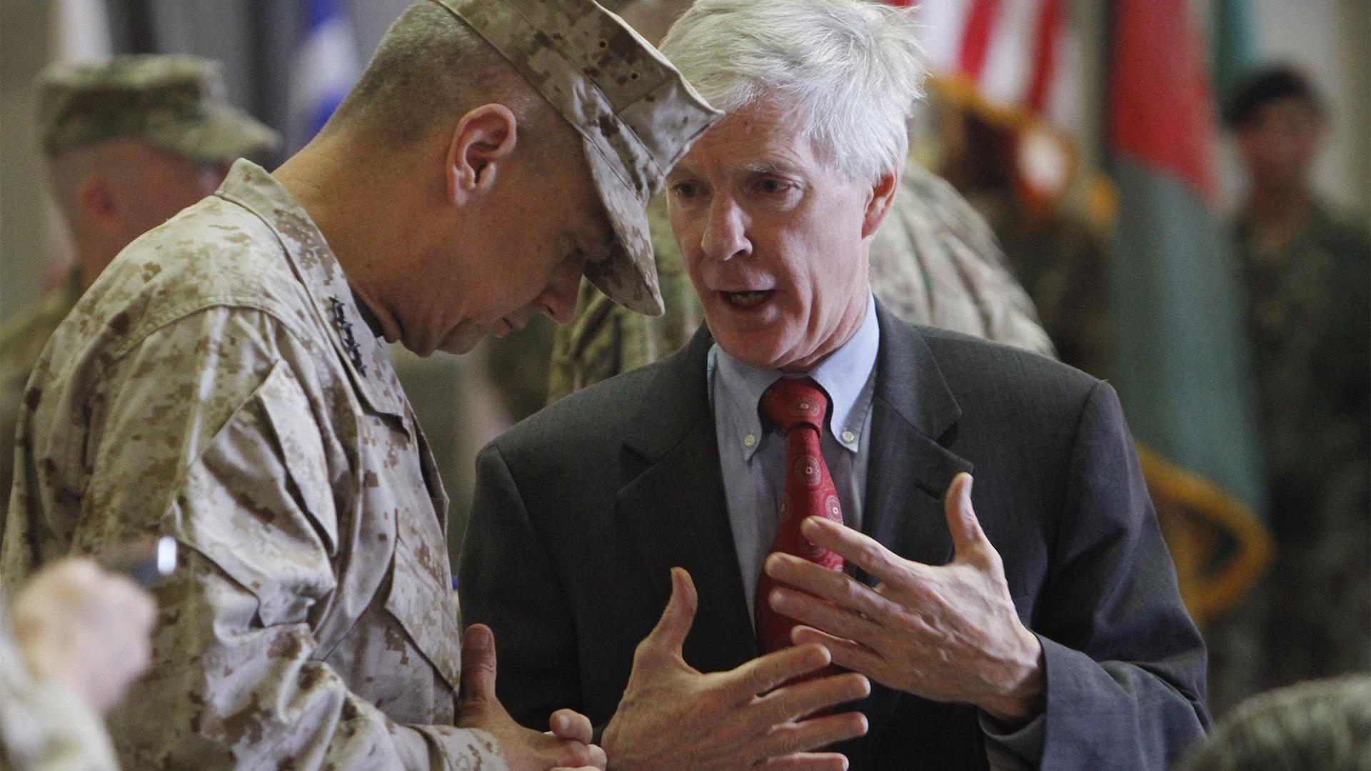US Gen. John R. Allen, left, commander of NATO forces in Afghanistan, listens to US ambassador to Afghanistan, Ryan Crocker, before a change of command ceremony in Kabul, Afghanistan