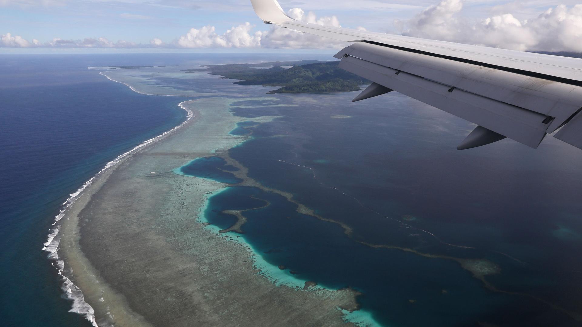 Former US Secretary of State Mike Pompeo's plane makes its landing approach on Pohnpei International Airport in Kolonia, Federated States of Micronesia, Monday, Aug. 5, 2019.