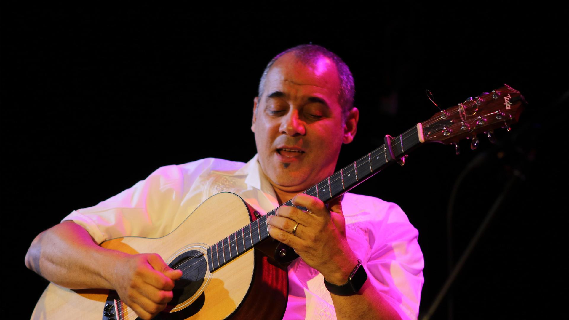 Enrique Kiki Valera is a multi-instrumentalist, composer, arranger, sound engineer and producer. He’s best known as one of the world’s greatest players of the Cuban cuatro, a mid-size guitar with eight strings grouped in sets of two. 