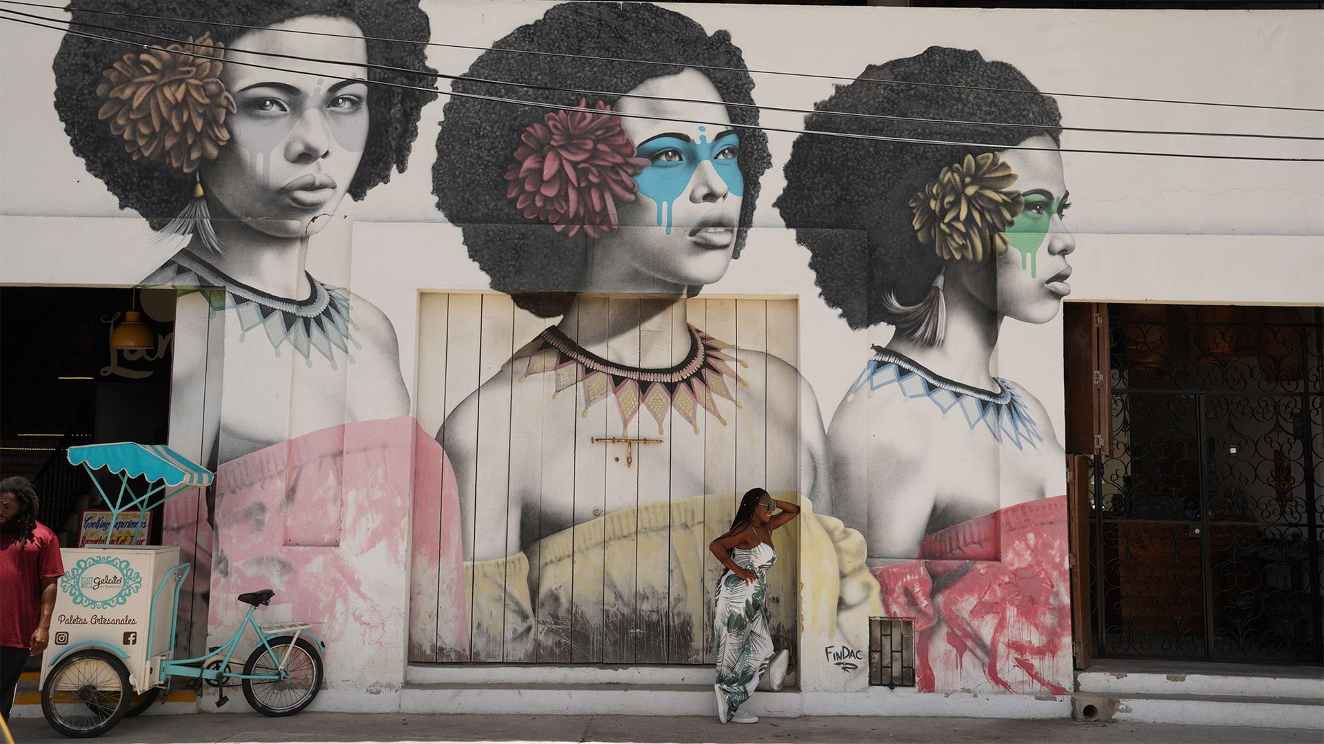 A mural in Cartagena's Getsemani Neighborhood celebrates the city's Afro-Colombian heritage and the natural hairstyles of Black women