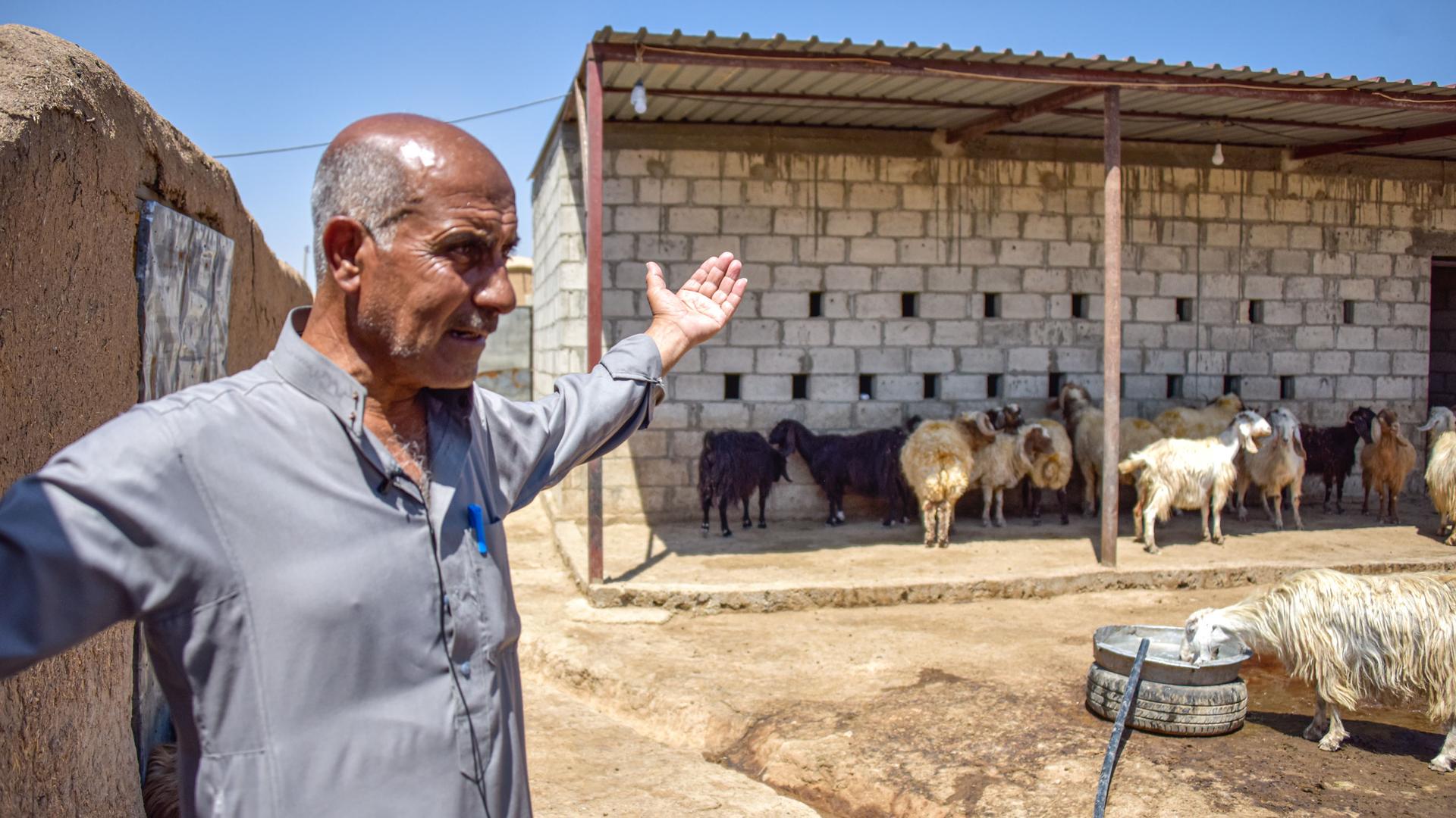 Yassin, a farmer from al-Sebat village in Rural Hasakah, stands in the yard where he keeps his livestock while explaining the catastrophic effects of drought on his life. 