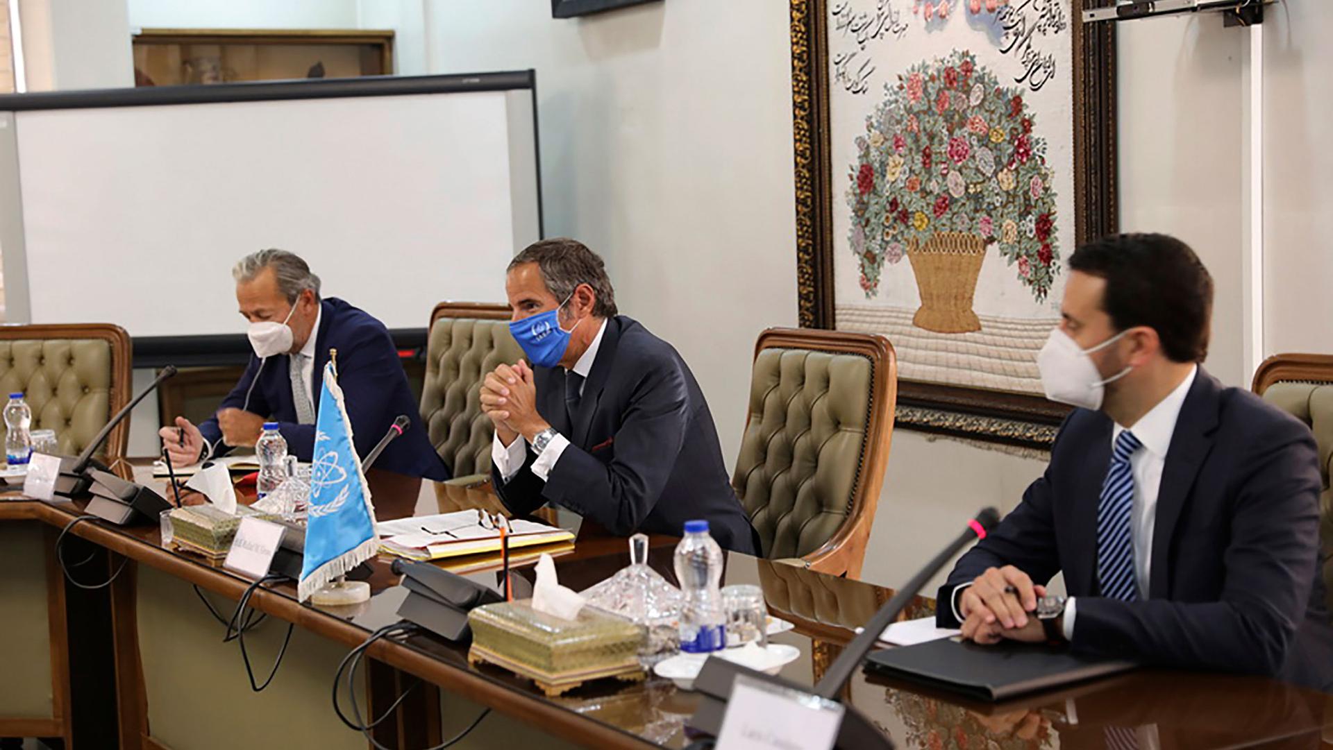 Rafael Mariano Grossi, director-general of International Atomic Energy Agency, IAEA, center, attends a meeting with the Head of Atomic Energy Organization of Iran, Mohammad Eslami, in Tehran, Iran, Sunday, Sept. 12, 2021.