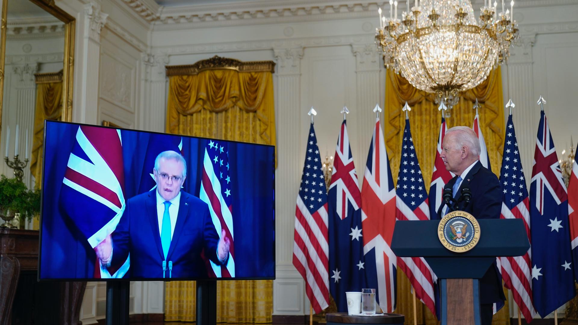 President Joe Biden listens as he is joined virtually by Australian Prime Minister Scott Morrison and British Prime Minister Boris Johnson, not seen, as he speaks about a national security initiative from the East Room of the White House in Washington, Se