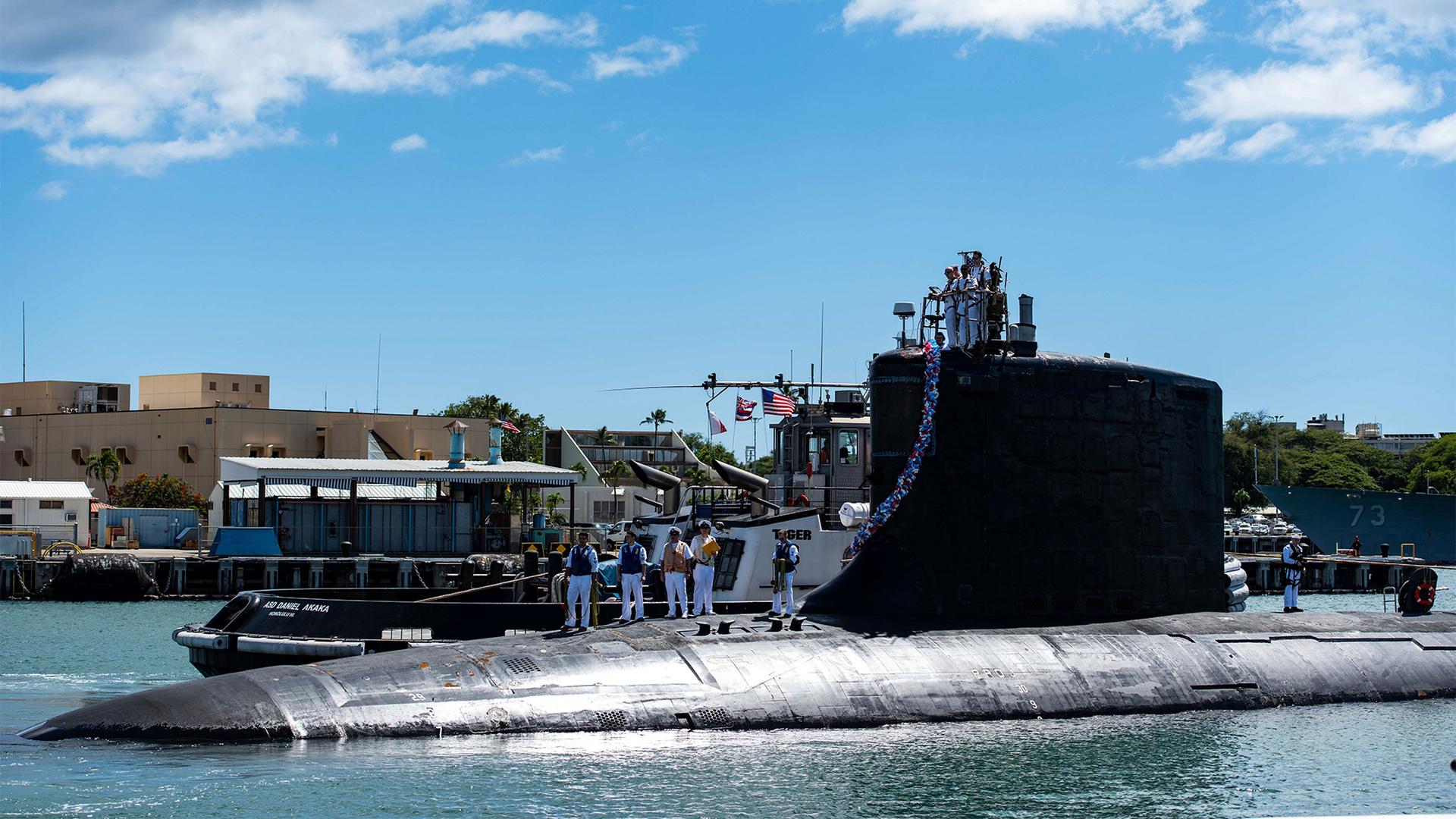 In this photo provided by US Navy, the Virginia-class fast-attack submarine USS Illinois (SSN 786) returns home to Joint Base Pearl Harbor-Hickam from a deployment in the 7th Fleet area of responsibility