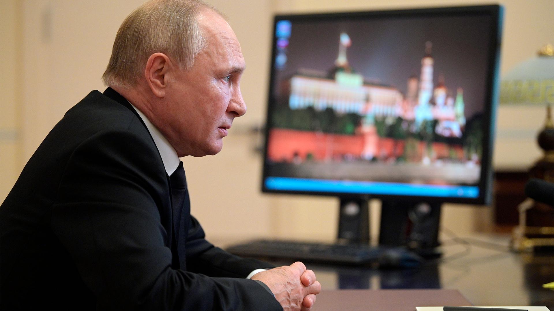 Russian President Vladimir Putin speaks to Ella Pamfilova, head of Russian Central Election Commission during their meeting via video conference at the Novo-Ogaryovo residence outside Moscow, Russia