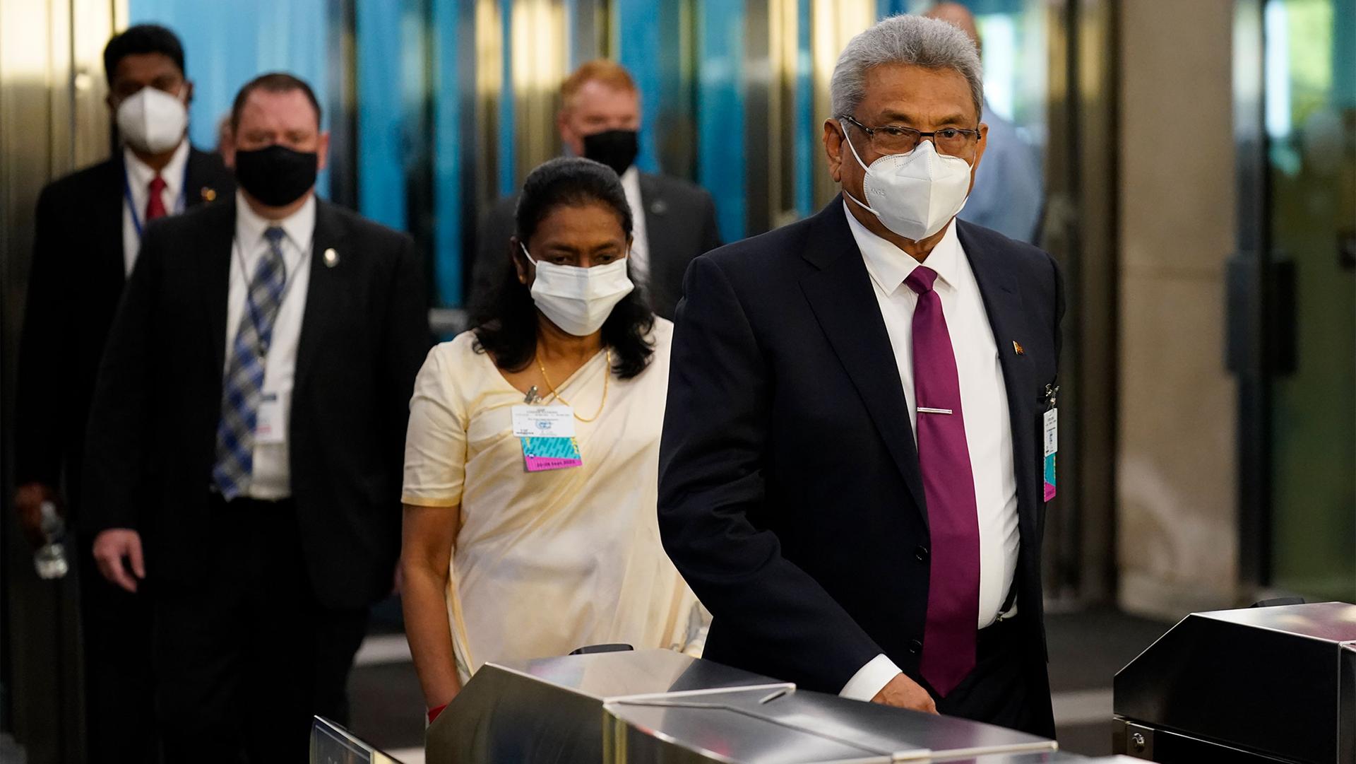 Gotabaya Rajapaksa, president of Sri Lanka, right, arrives at United Nations headquarters, during the 76th Session of the UN General Assembly in New York