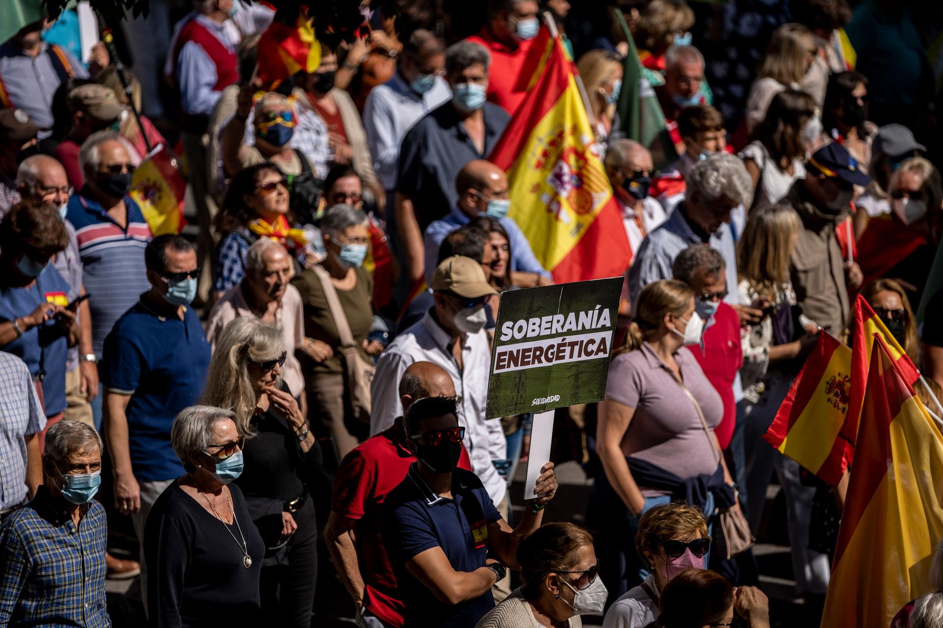 People take part during a protest against the increases in the price of electricity in Madrid, Spain, Sunday, Sept. 19, 2021. Gas and electric prices are spiking in Europe.