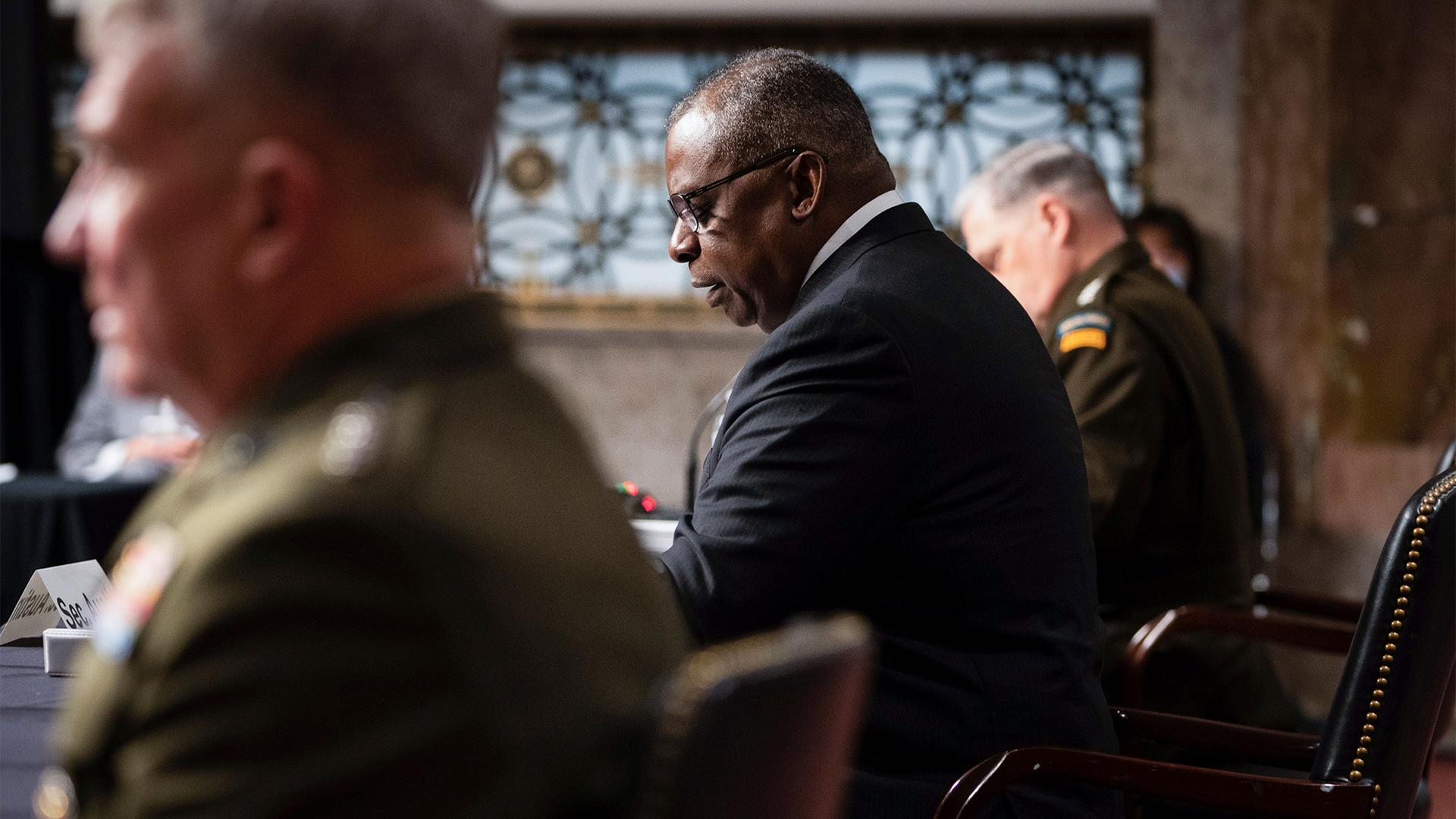 From left, Gen. Kenneth McKenzie, commander of the United States Central Command, Defense Secretary Lloyd Austin, and Chairman of the Joint Chiefs of Staff Gen. Mark Milley testify during a Senate Armed Services Committee hearing on Capitol Hill