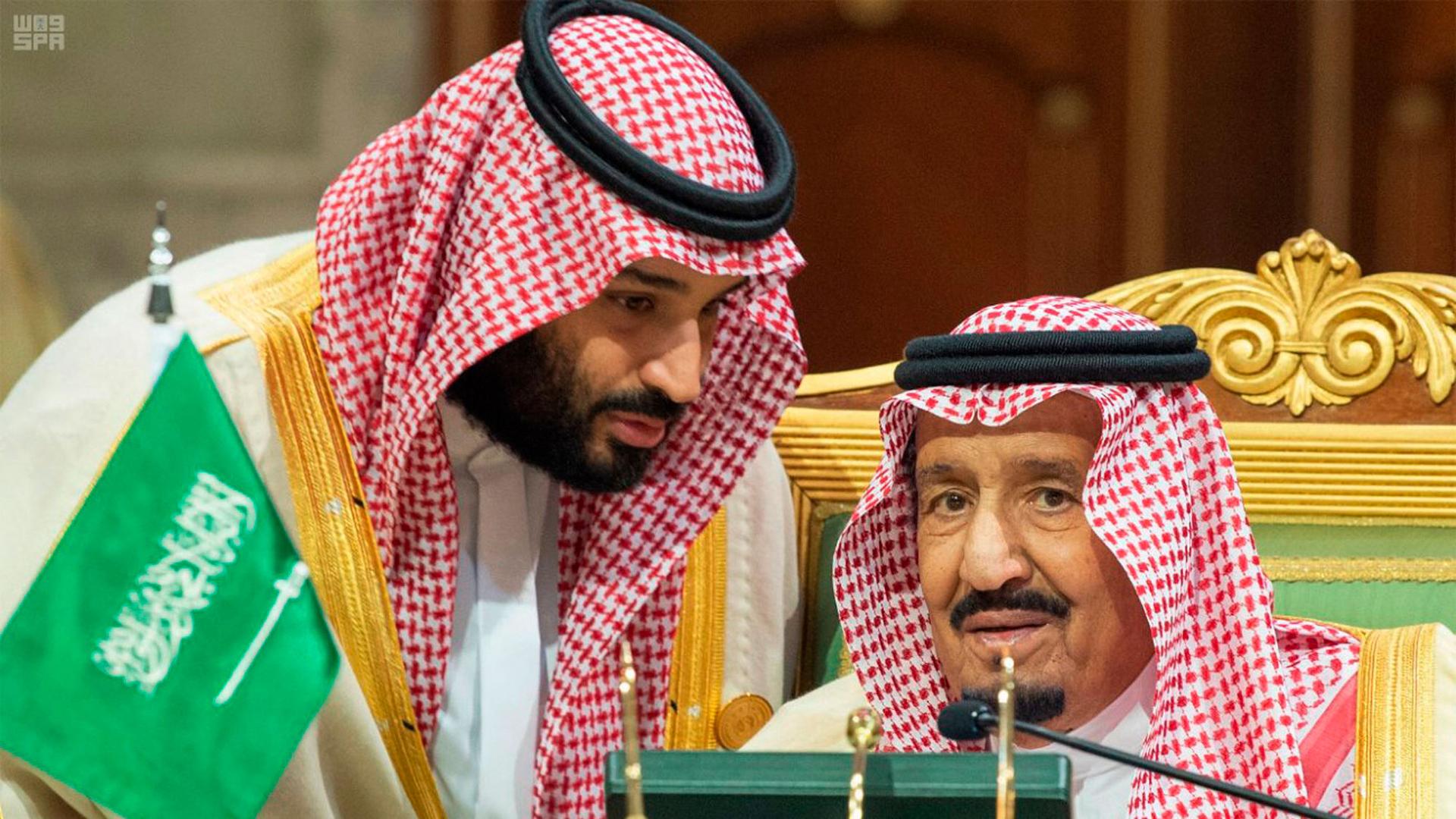 In this photo released by the state-run Saudi Press Agency, Saudi Crown Prince Mohamed bin Salman, left, speaks with his father, King Salman, right, at a meeting of the Cooperation Council for the Arab States of the Gulf in Riyadh, Saudi Arabia.