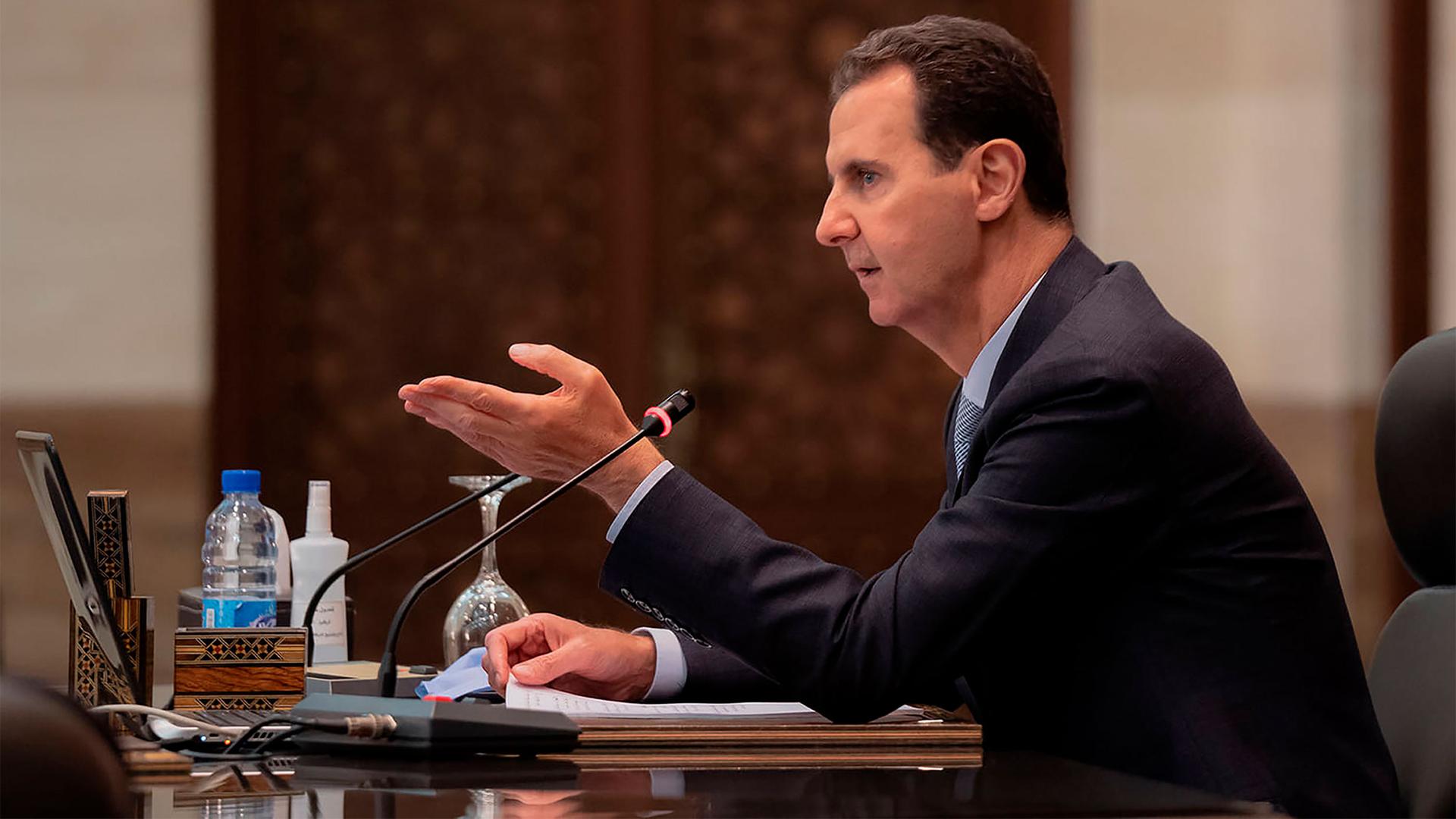 Syrian President Bashar al-Assad heads a cabinet meeting, in Damascus, Syria