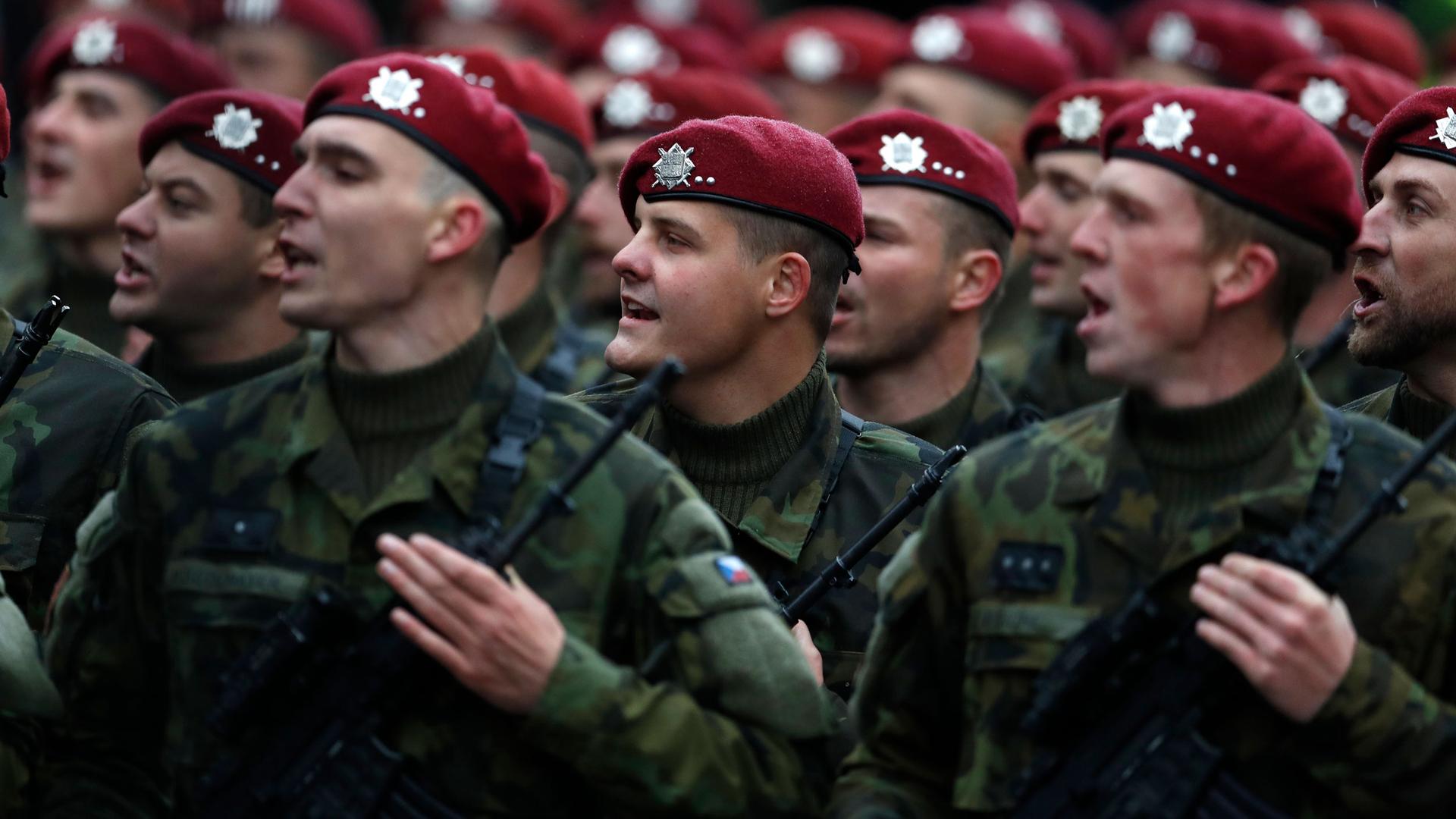 Soldiers march during a military parade marking 100th anniversary of the 1918 creation of the Czechoslovak state in Prague, Czech Republic, Sunday, Oct. 28, 2018. 