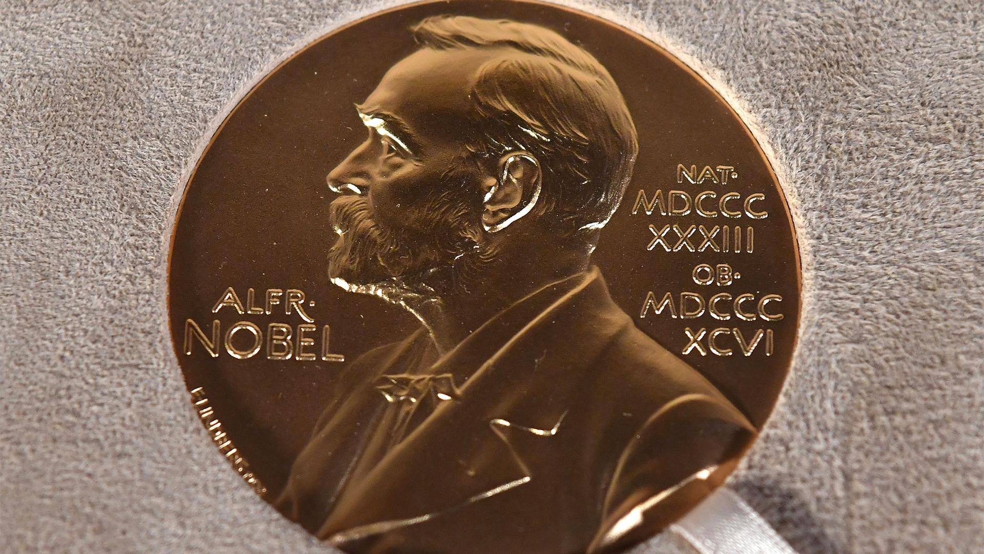 Photo of a Nobel medal displayed during a ceremony in New York