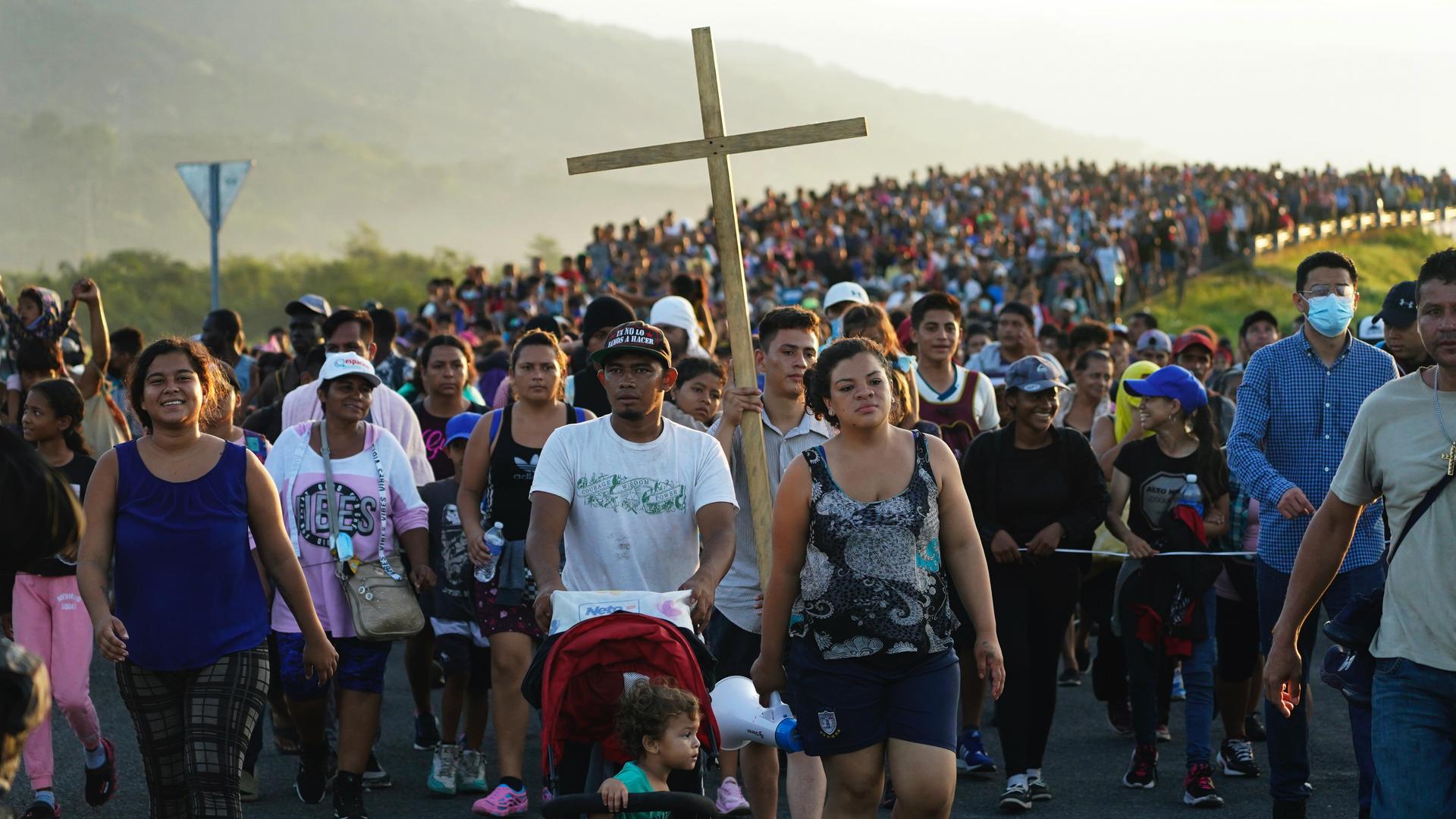 Migrants leave Huixtla, Chiapas state, Mexico, early Oct. 27, 2021, as they continue their trek north toward Mexico's northern states and the US border.