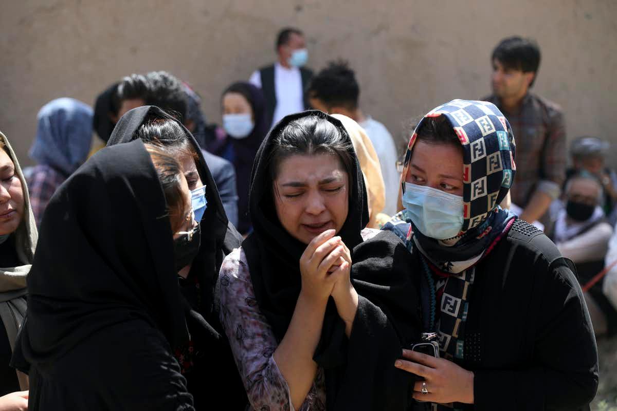 Afghan women consoling each other in grief