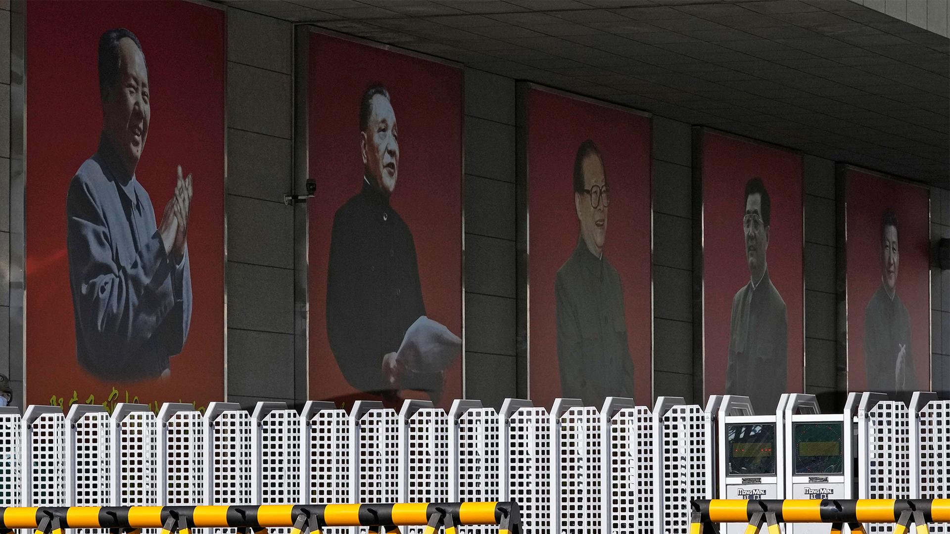 Portraits of China's former top leaders from left Mao Zedong, Deng Xiaoping, Jiang Zemin, Hu Jintao and including the current President Xi Jinping are seen at a military camp in Beijing, China
