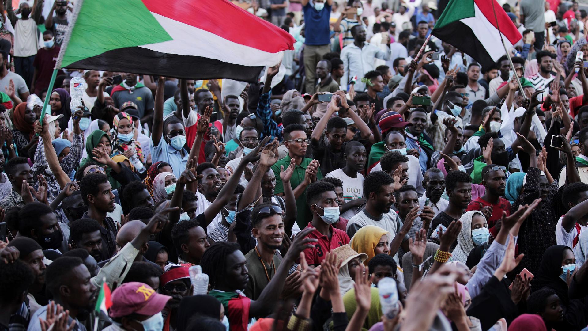 People chant slogans during a protest in Khartoum, Sudan, Saturday, Oct. 30, 2021. 