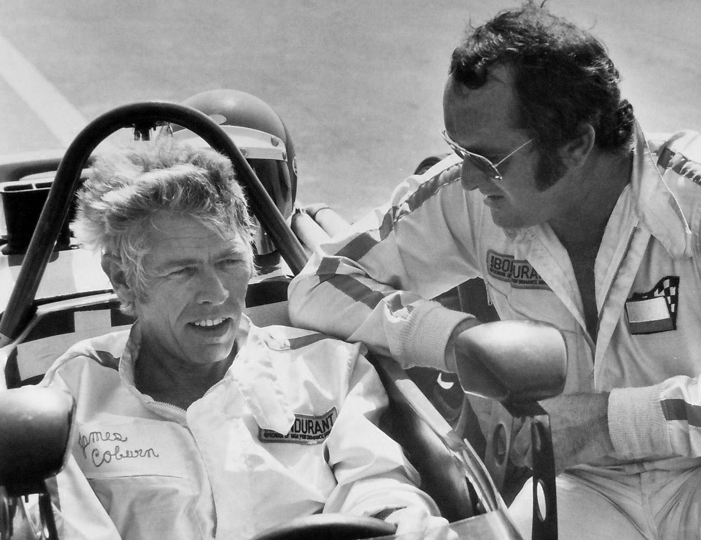 Photo of Bob Bondurant teaching actor James Coburn how to drive a race car, April 16, 1972. 
