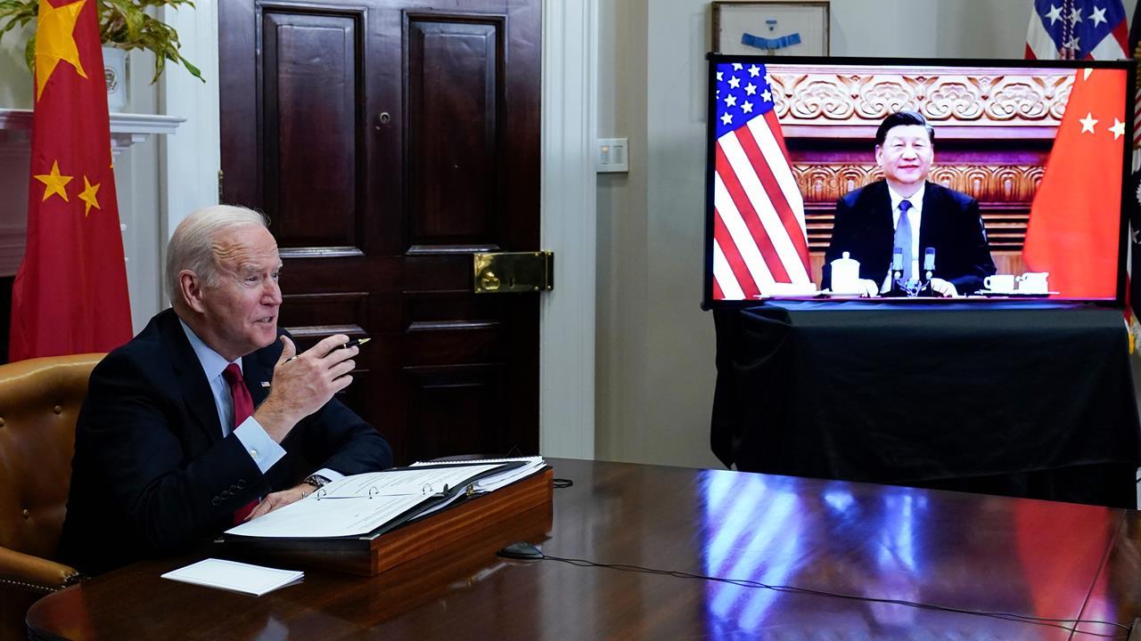 President Joe Biden meets virtually with Chinese President Xi Jinping from the Roosevelt Room of the White House in Washington