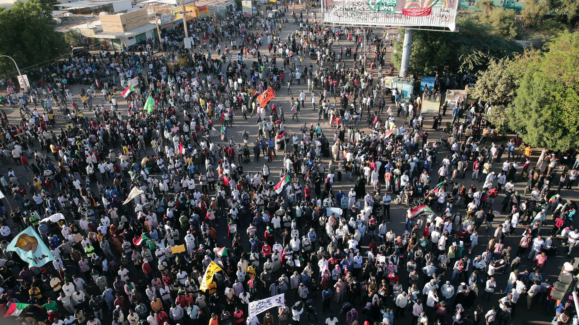 Thousands of protesters take to the streets to renew their demand for a civilian government in the Sudanese capital Khartoum, Nov. 25, 2021. The rallies came just days after the military signed a power-sharing deal with the prime minister, after releasing