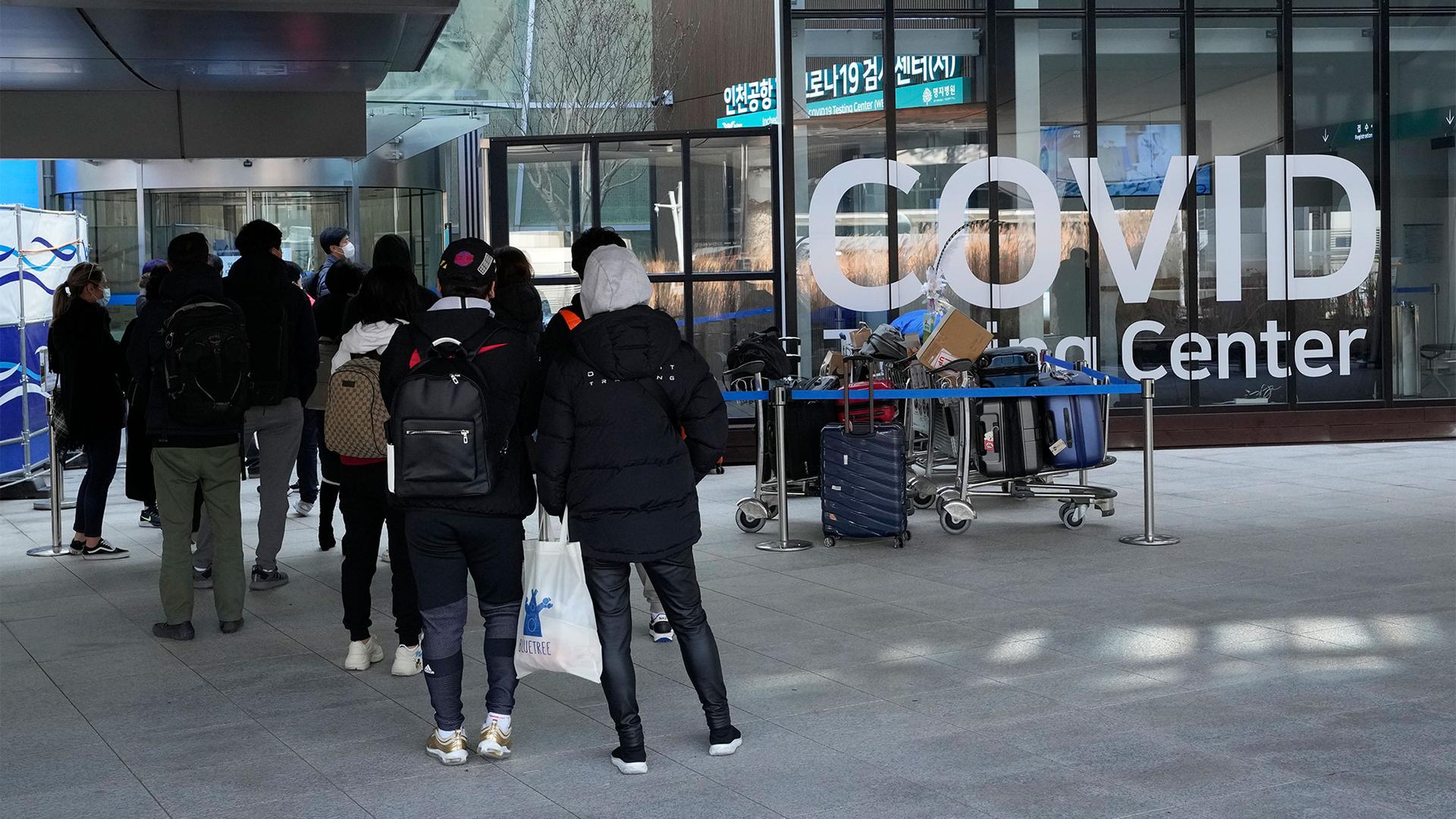 Travelers wait for the coronavirus testing at the Incheon International Airport in Incheon, South Korea