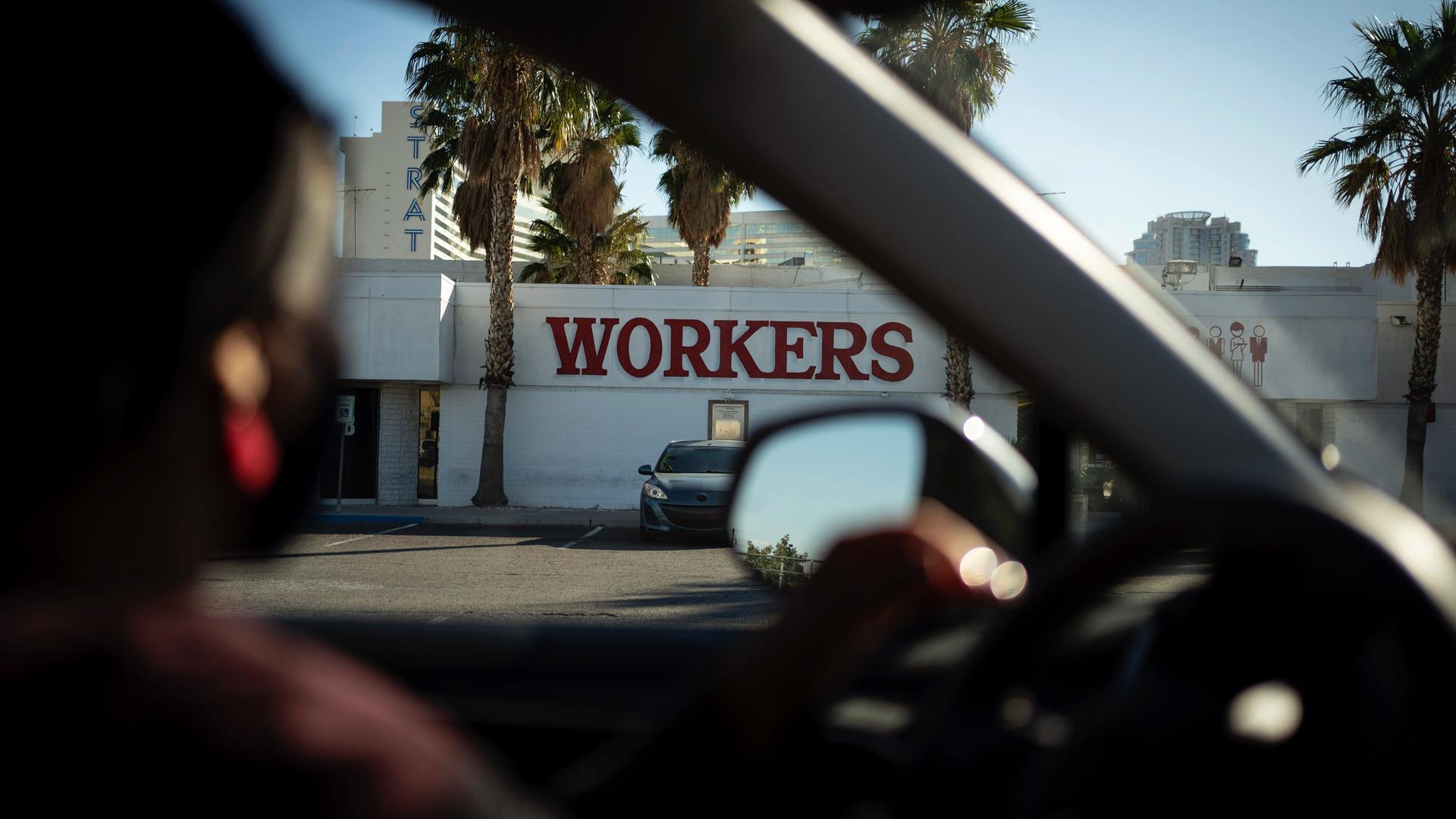 The office of the Culinary Workers Union is seen through a car window in Las Vegas, Nov. 9, 2020. The union represents 60,000 people, most of them immigrants, in the Las Vegas area who work in the hospitality industry. 