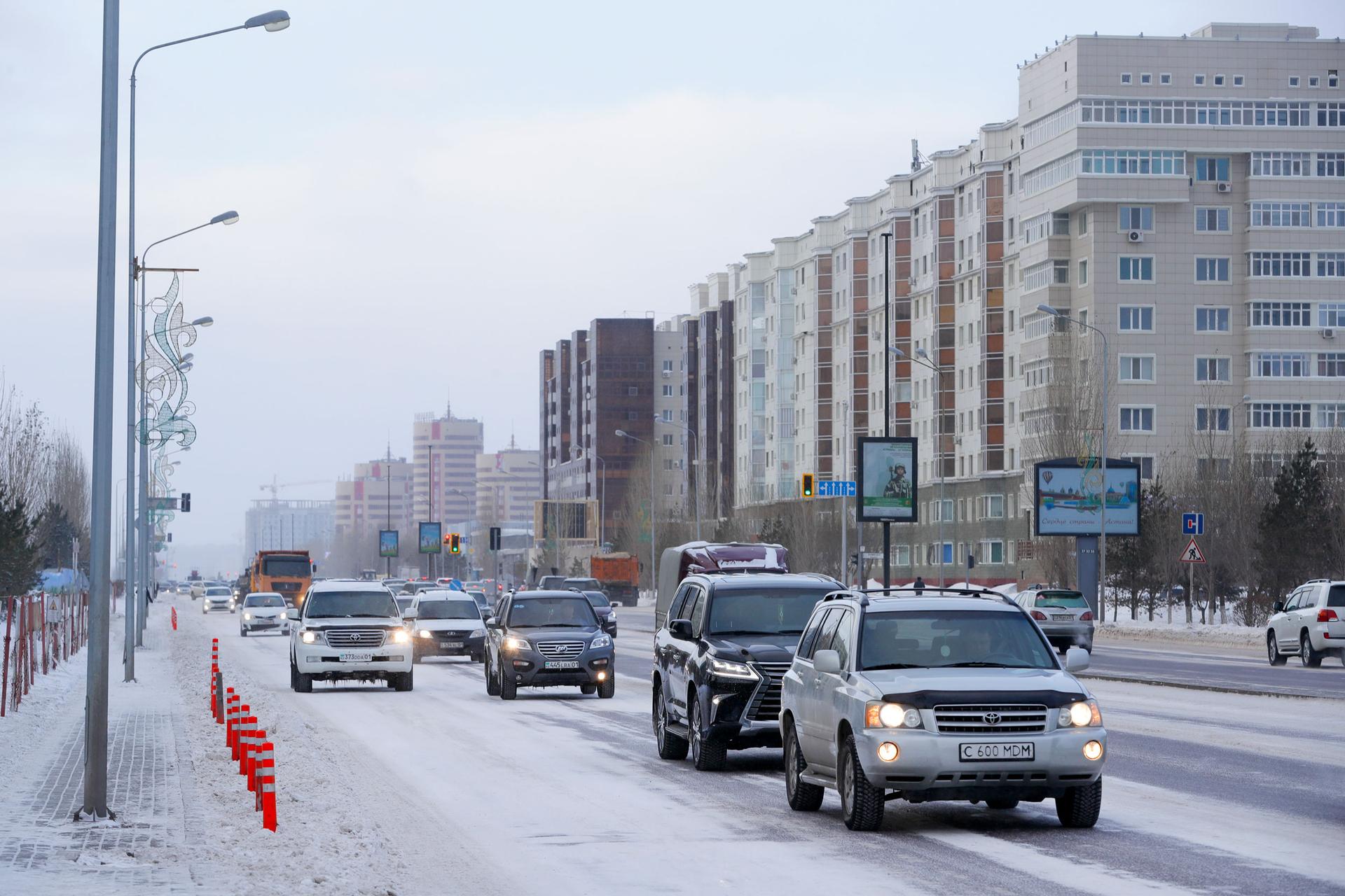 Cars drive along a road in Astana, Kazakhstan, on Monday, Jan. 23, 2017.