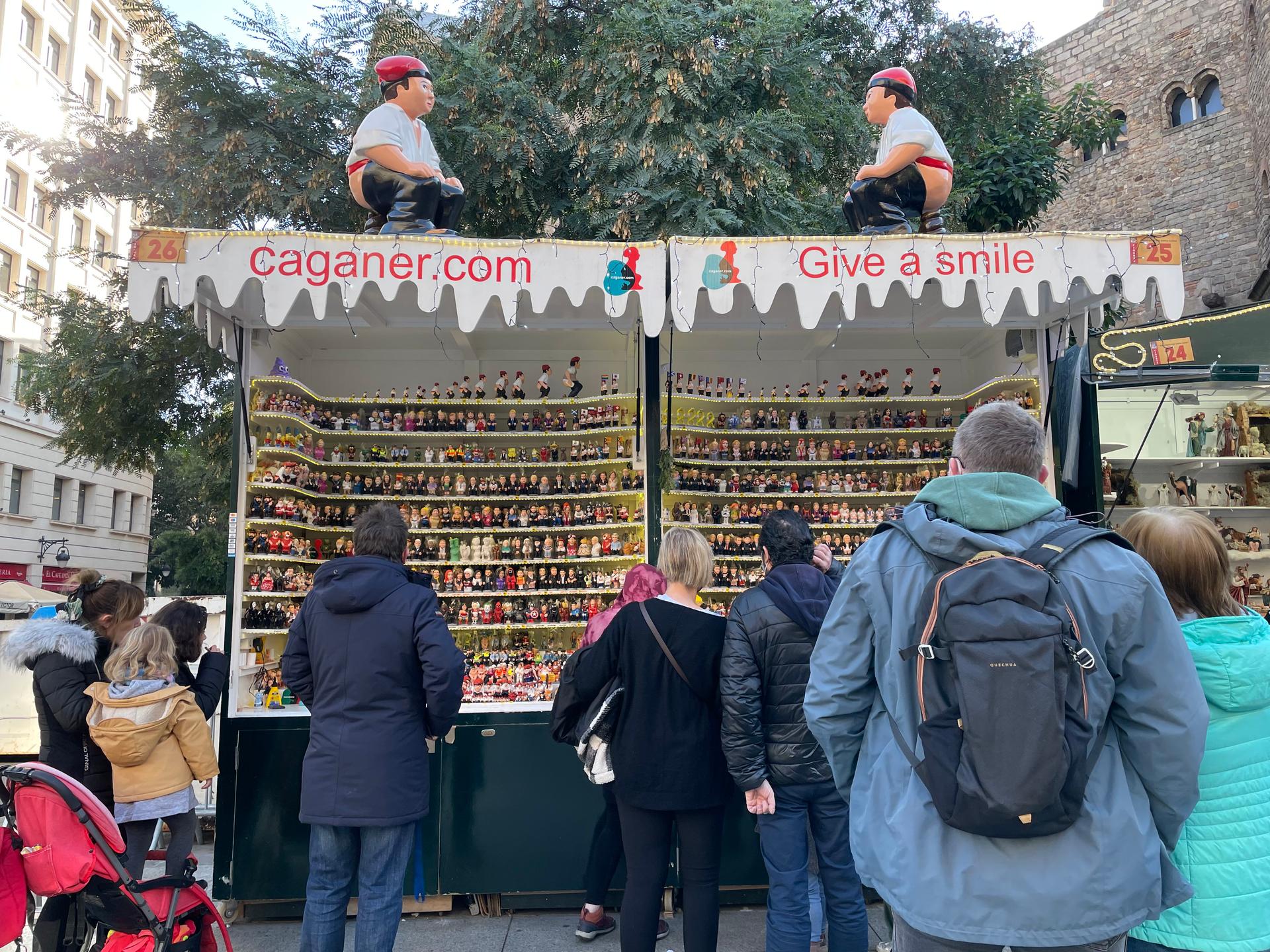 At Barcelona's oldest Christmas market, Fira de Santa Llúcia, Marc Alós sells handmade Caganers. His company, founded by his mother in 1992, now has more than 500 versions of the Caganer.