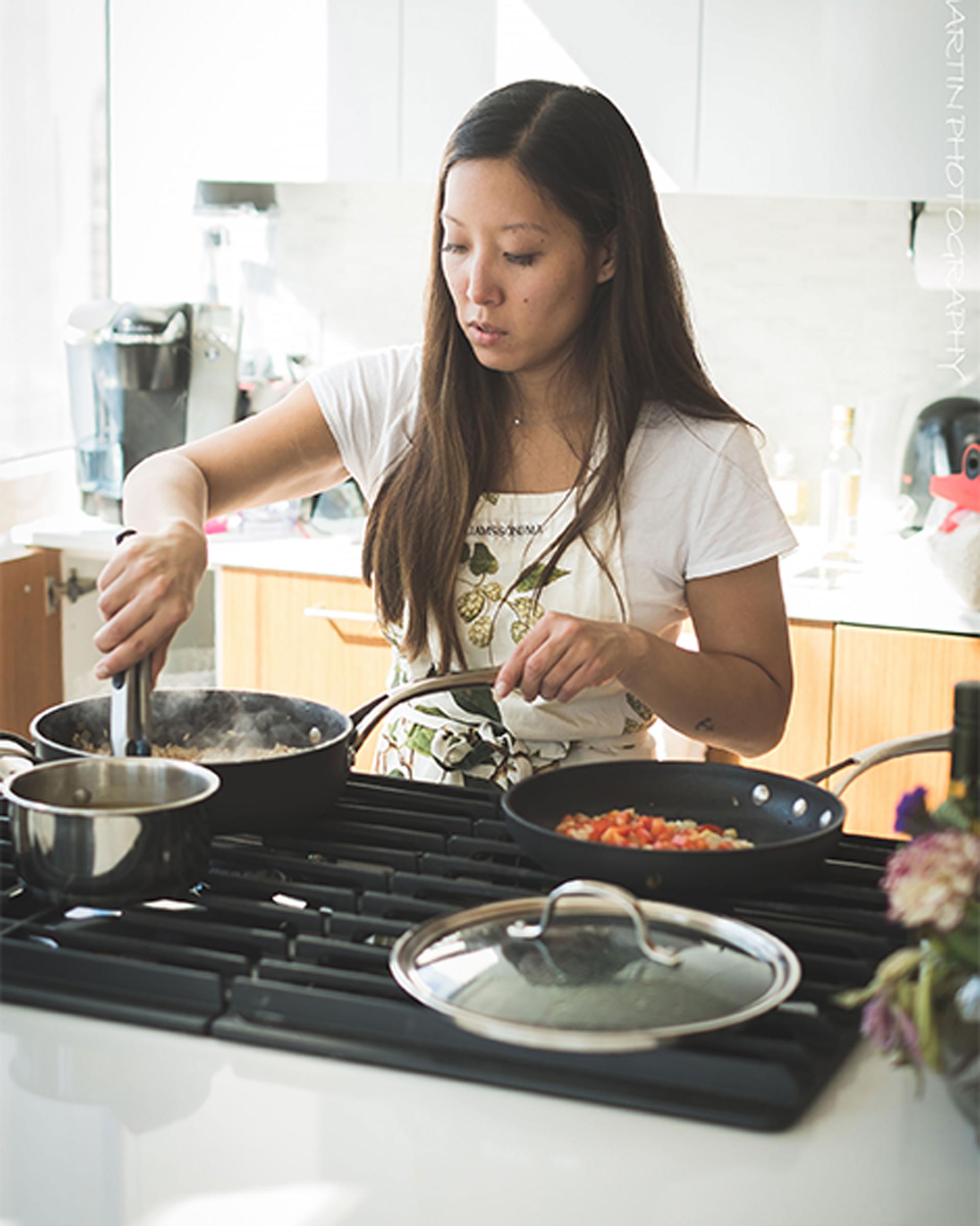 Food blogger Joanne Lee Molinaro, known as the Korean Vegan, cooks in her kitchen.