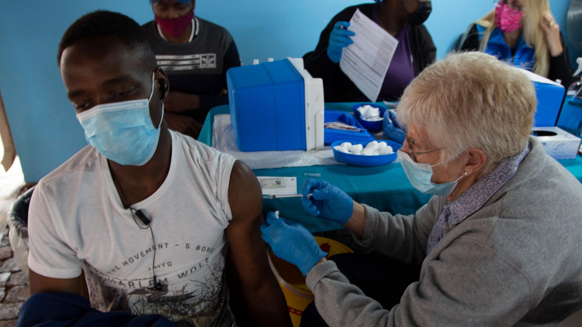 A man gets vaccinated against COVID-19 at a site near Johannesburg, Wednesday, Dec. 8, 2021. 