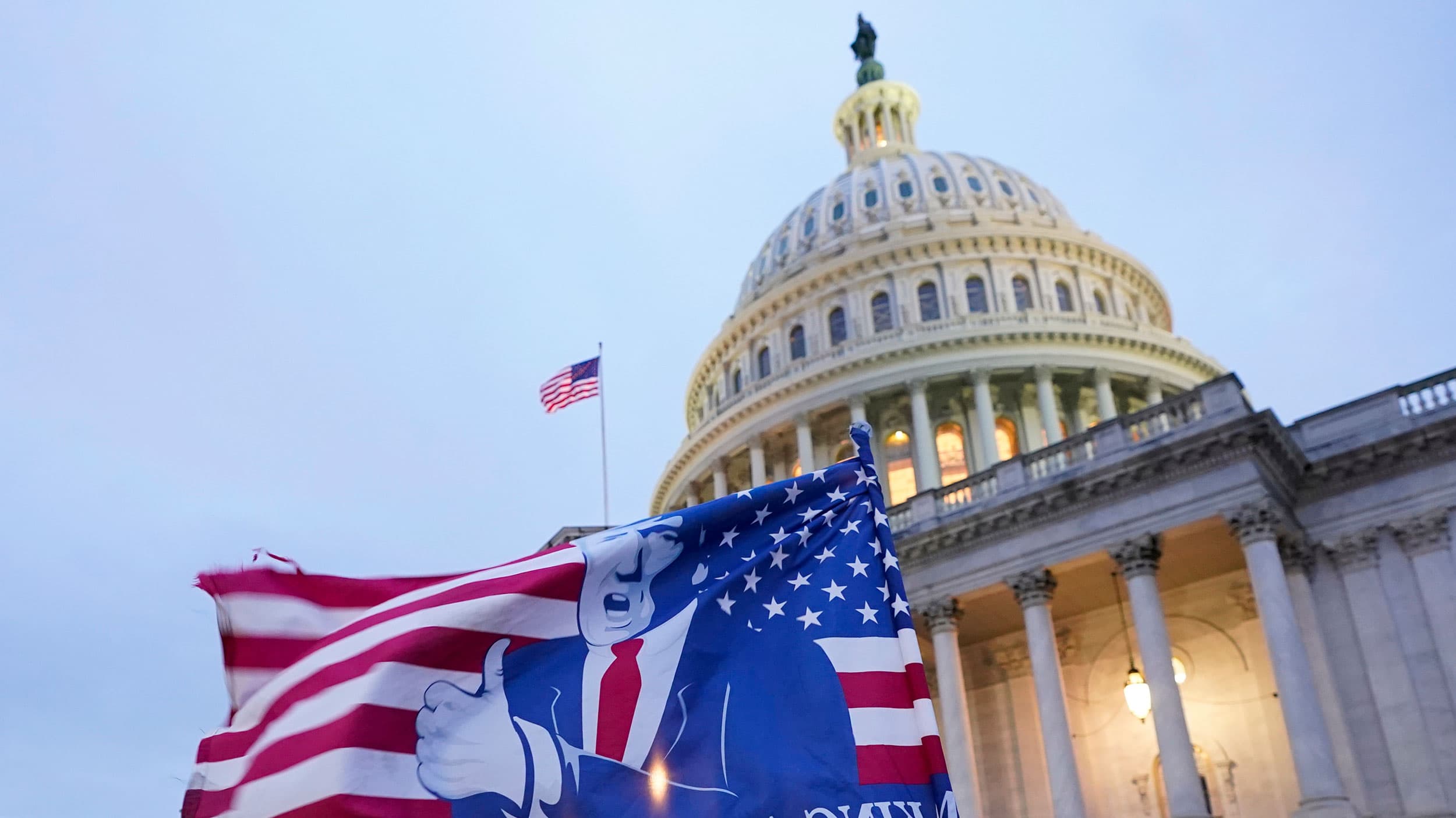 A flag depicting President Donald Trump flies on the East Front of the US Capitol on Jan. 6, 2021, in Washington.