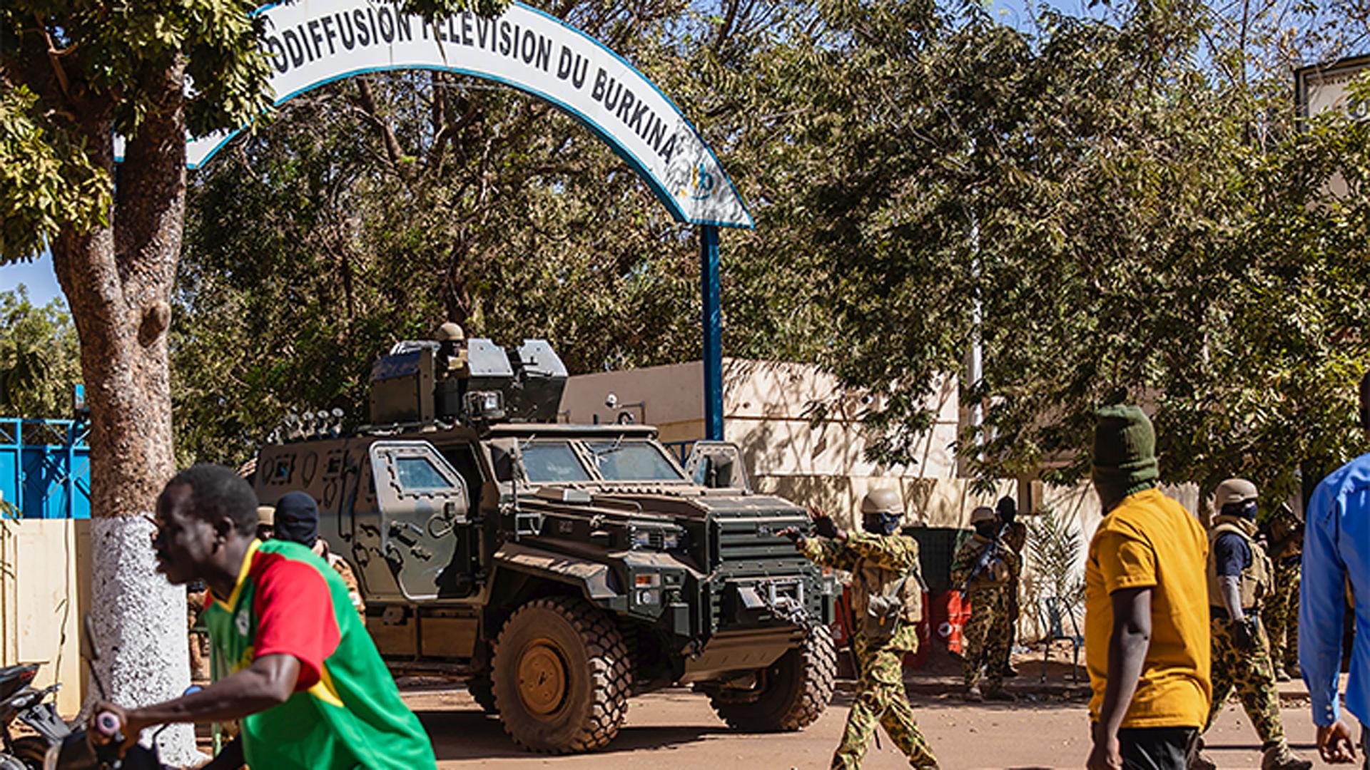 Mutinous soldiers guard the entrance of the national television station in Ouagadougou, Burkina Faso