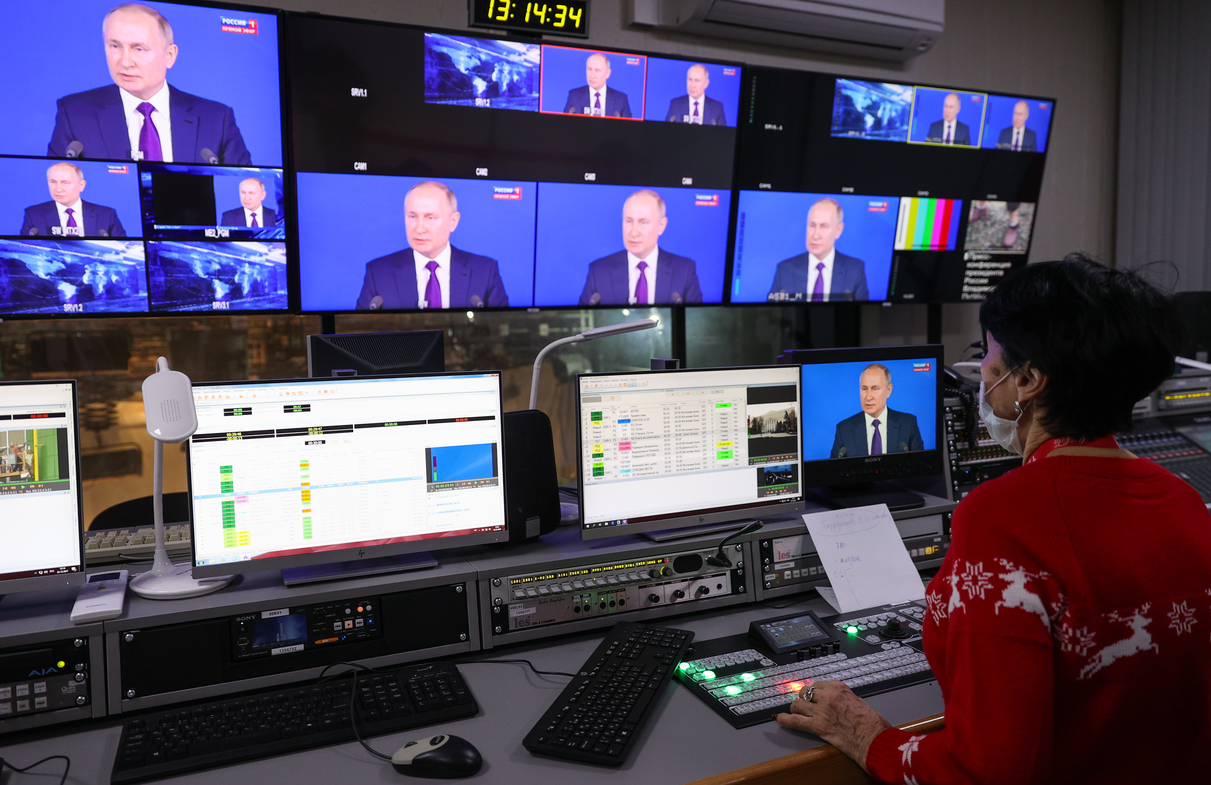 A live broadcast of Russian President Vladimir Putin speaking is shown on Dec. 23, 2021, from a media control room in Russia. 