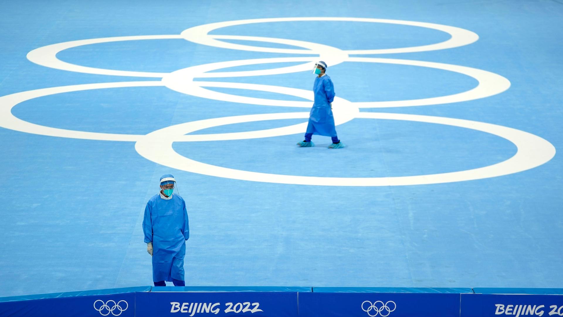 Medical personnel stand ready for activity during a scheduled speedskating practice session inside at the National Speed Skating Oval the 2022 Winter Olympics, Thursday, Jan. 27, 2022, in Beijing.