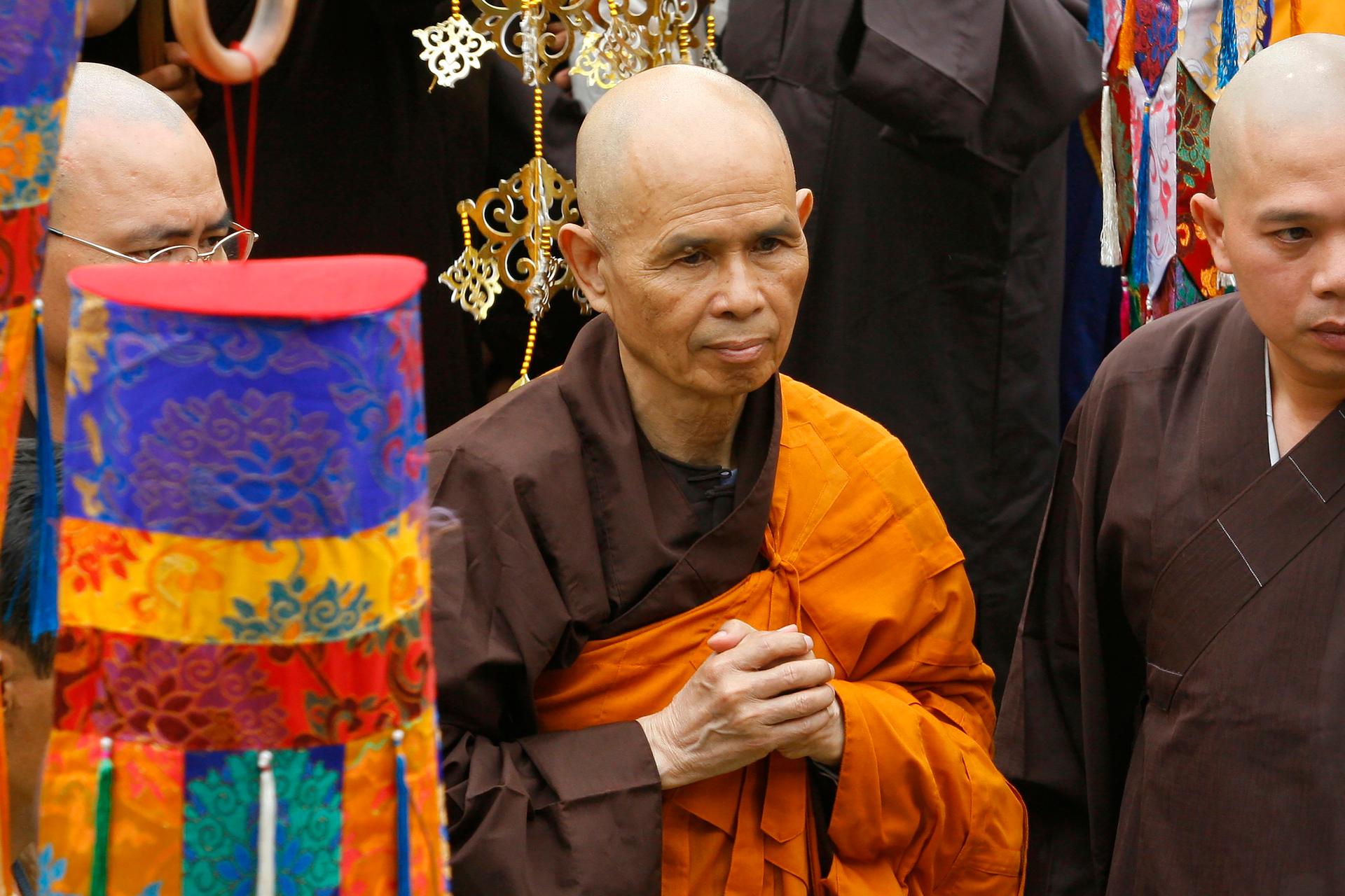 Vietnamese Zen master Thich Nhat Hanh, center, arrives for a great chanting ceremony at Vinh Nghiem Pagoda in Ho Chi Minh City, Vietnam on March 16, 2007.