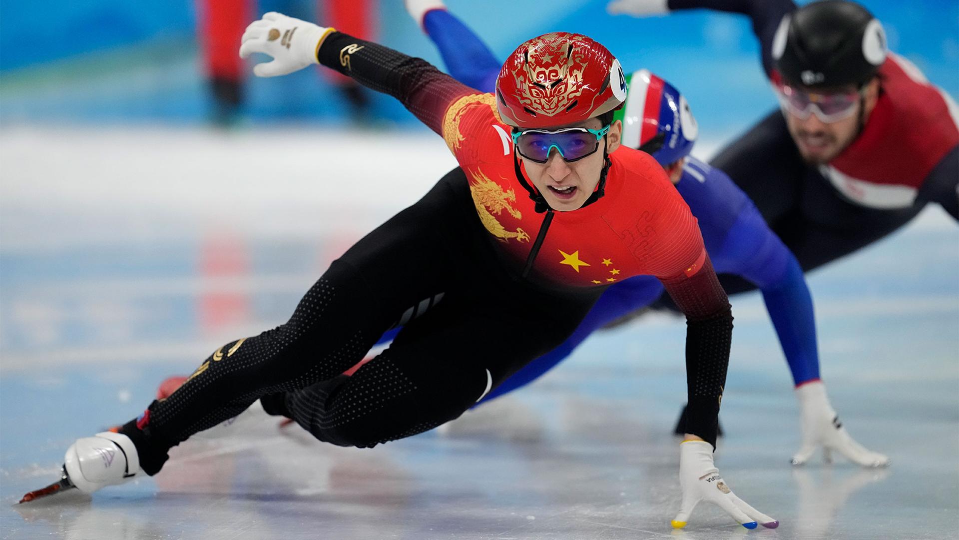 Wu Dajing of China, races in his men's 500-meters heat during the short track speedskating competition at the 2022 Winter Olympics in Beijing