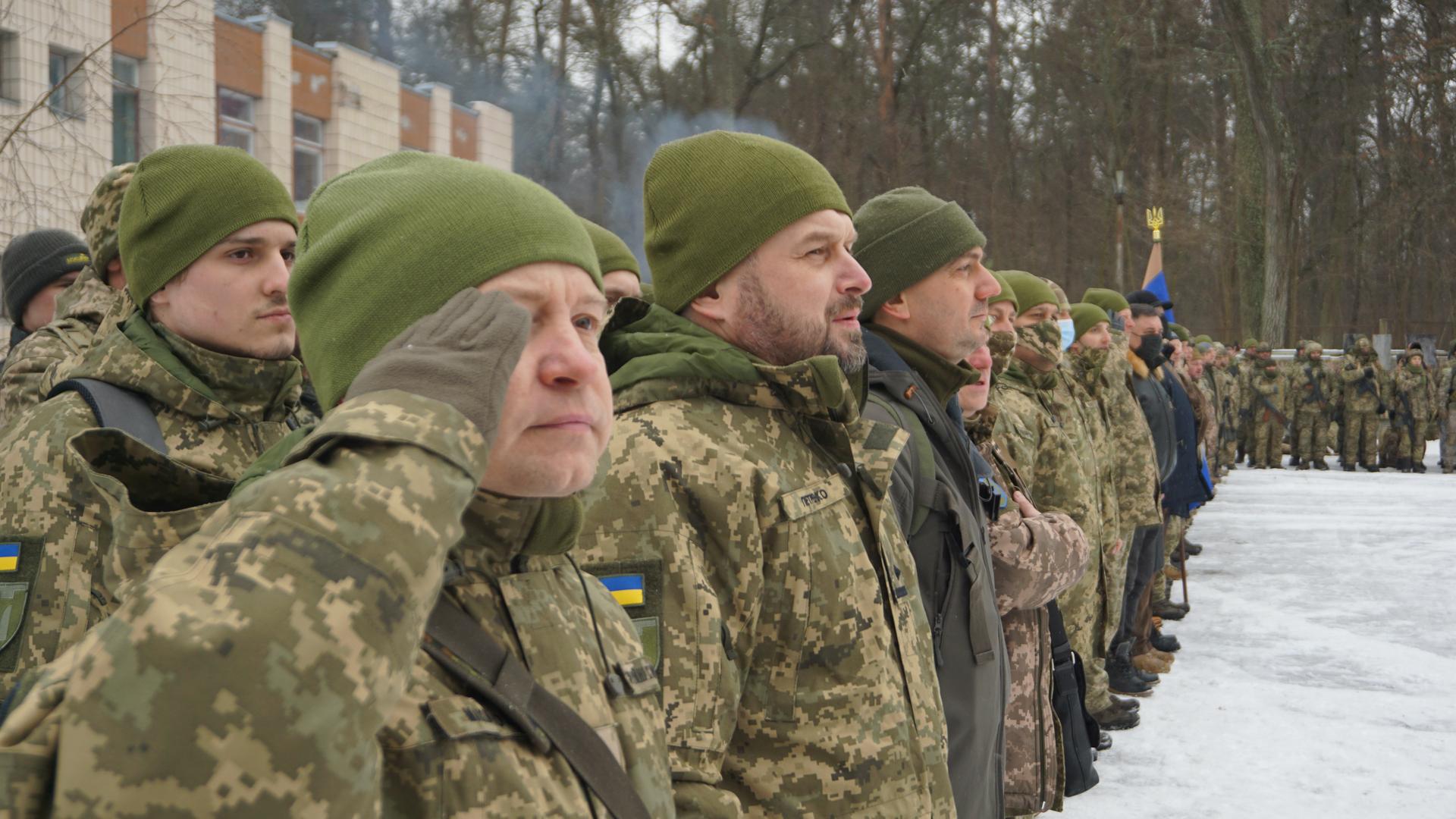 On the outskirts of Kyiv in a forested area, between the capital and its international airport, something called “territorial defense training” is underway — where civilian volunteers learn how to be soldiers. The training is led by reservist officers.