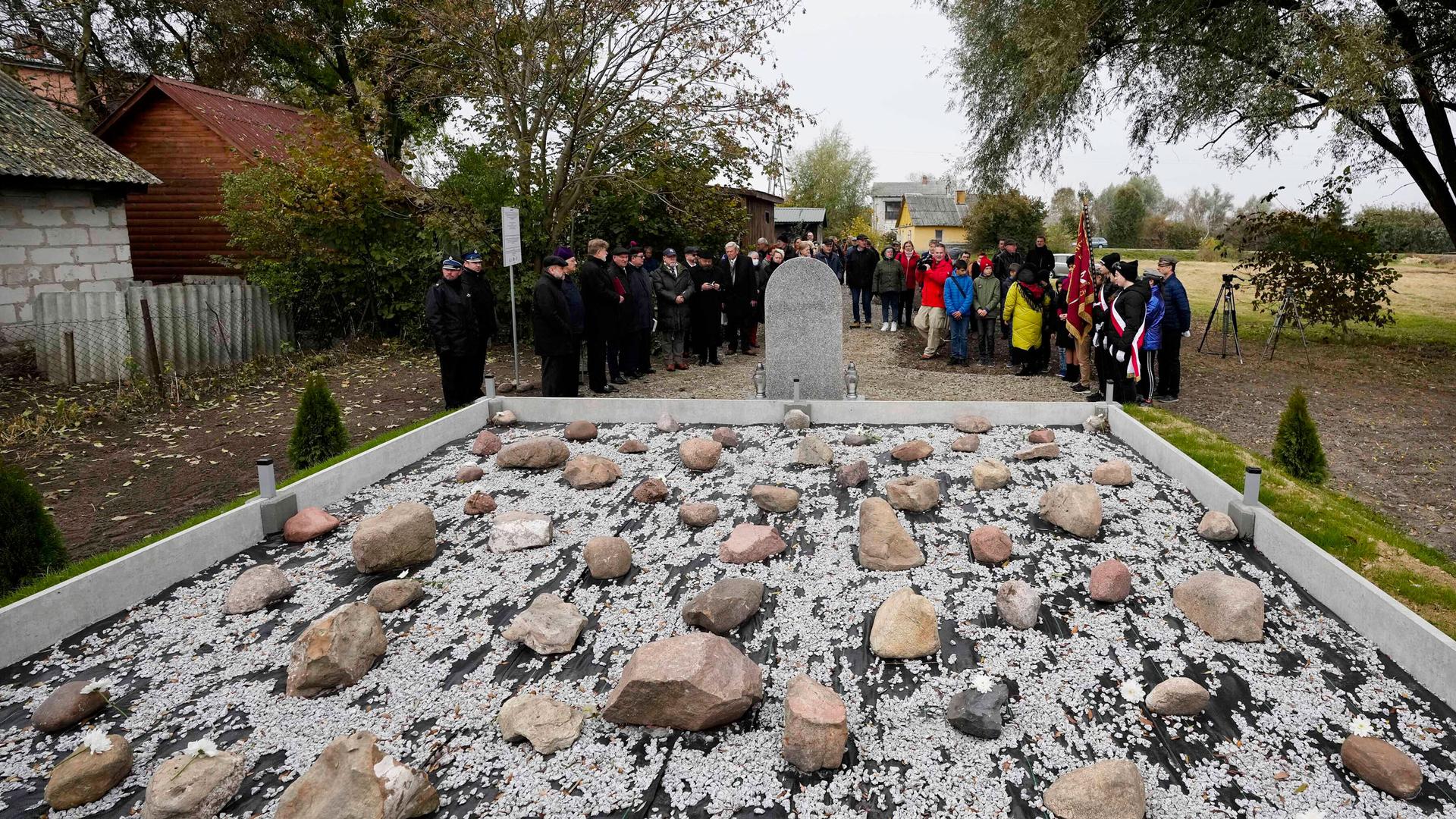 Jewish and Christian clergy stand together for prayers for the souls of some 60 Jews murdered by the occupying Nazi German forces during a ceremony marking a memorial to the victims in Wojslawice, Poland, Thursday, Oct. 14, 2021. 