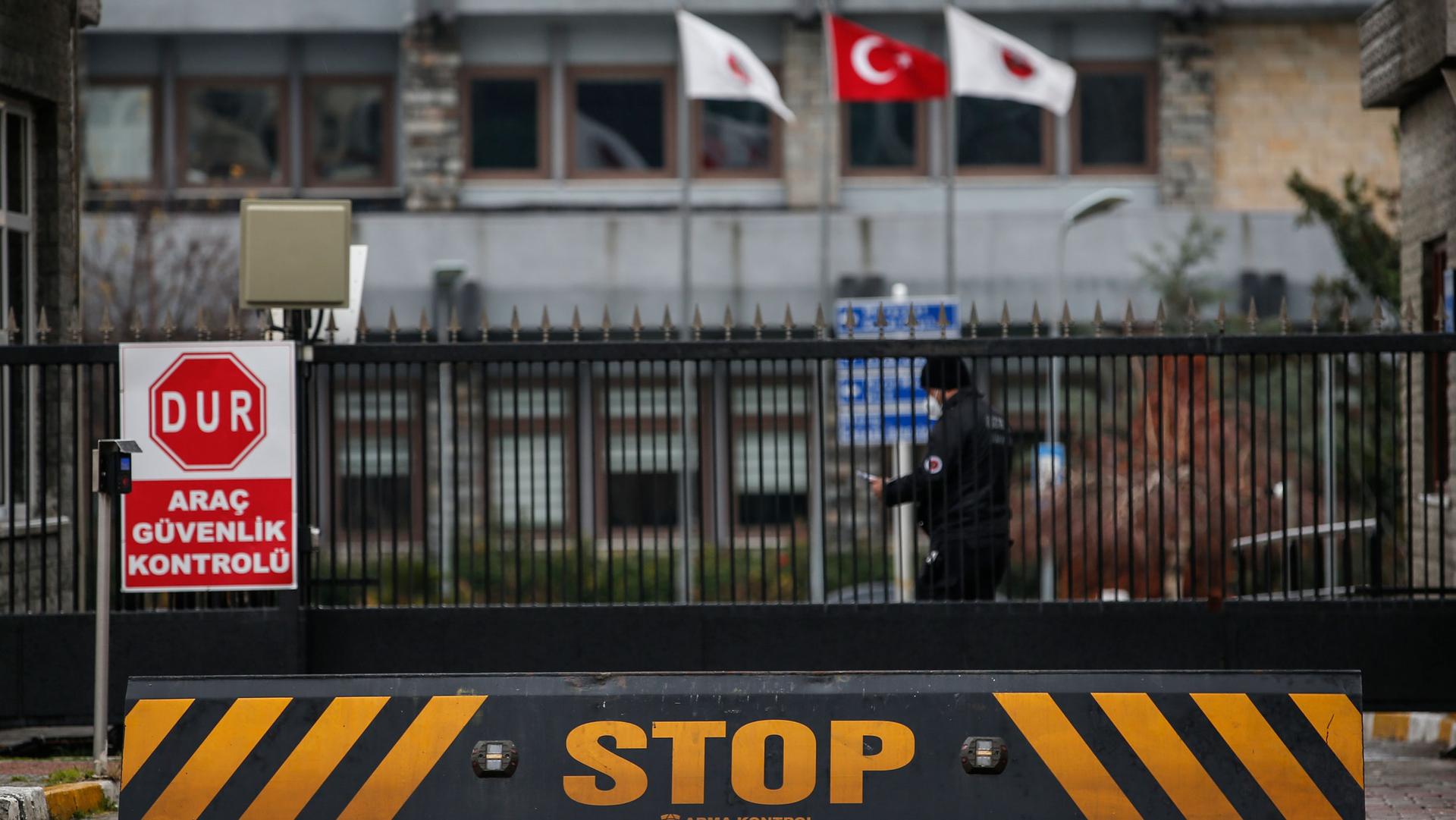 A security guard stands at the entrance of the Medical Forensic Institution in Istanbul, Thursday, Feb. 3, 2022. 