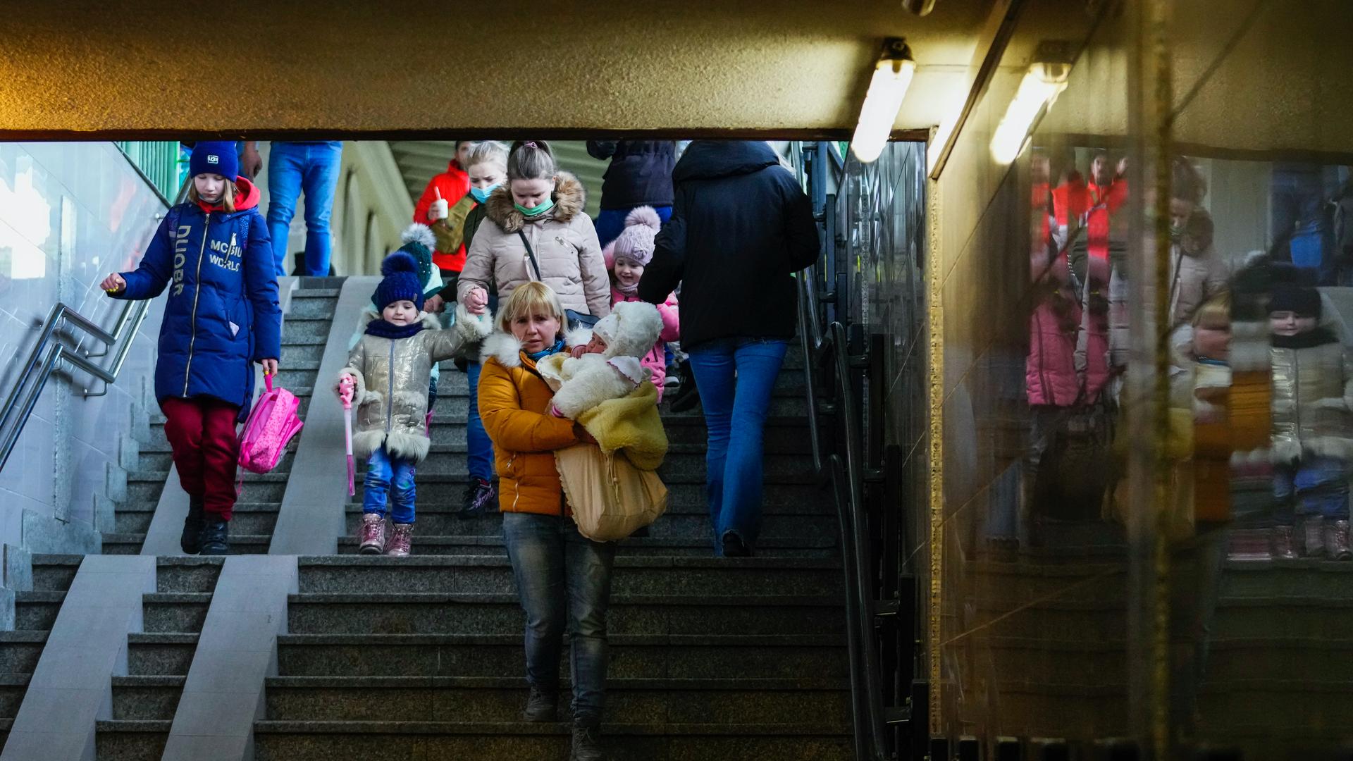 People fleeing the conflict from neighboring Ukraine arrive to Przemysl train station in Przemysl, Poland, on Feb. 25, 2022.