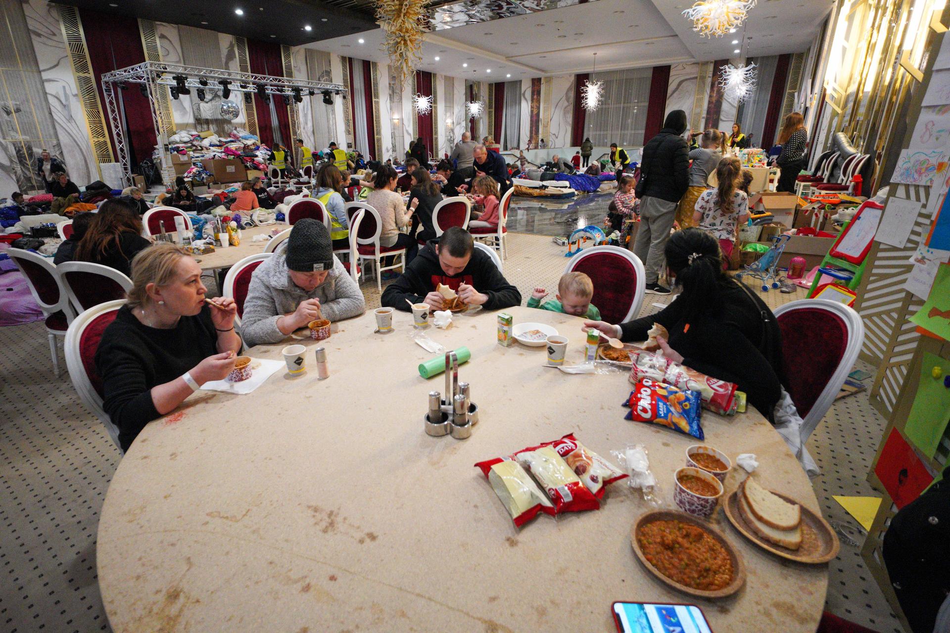 In the town of Suceava, Romania, the Mandachi Hotel and Spa, a four-star hotel converted its ballroom into a temporary shelter, serving food and other supplies to Ukrainian refugees.