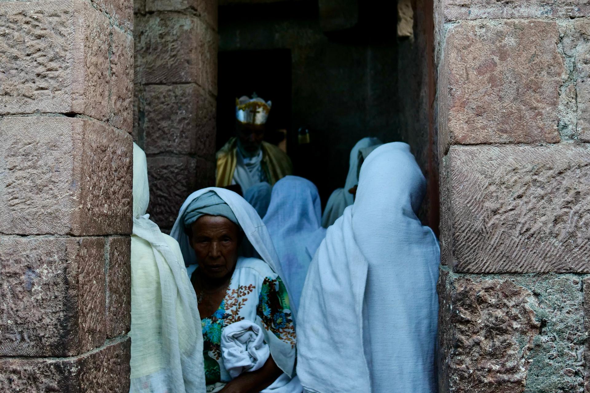 Women praying inside a 13th-century rock-hewn church in Lalibela, Ethiopia, Feb. 16, 2022.