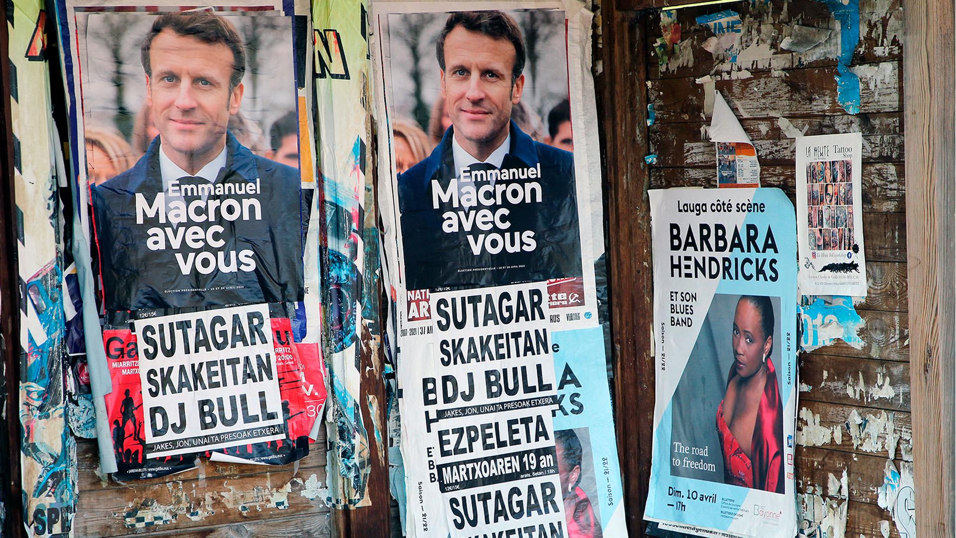 Posters of French President Emmanuel Macron and centrist candidate for reelection in Saint Pee sur Nivelle, southwestern France