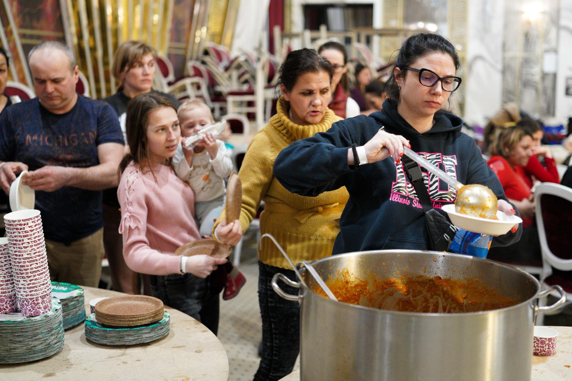 In the town of Suceava, Romania, the Mandachi Hotel and Spa, a four-star hotel converted its ballroom into a temporary shelter, serving food and other supplies to Ukrainian refugees.