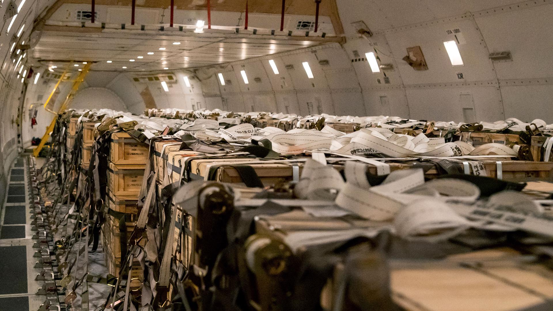 In this image provided by the US Air Force, pallets of ammunition, weapons and other equipment bound for Ukraine are loaded on a plane by members from the 436th Aerial Port Squadron during a foreign military sales mission at Dover Air Force Base, Delaware
