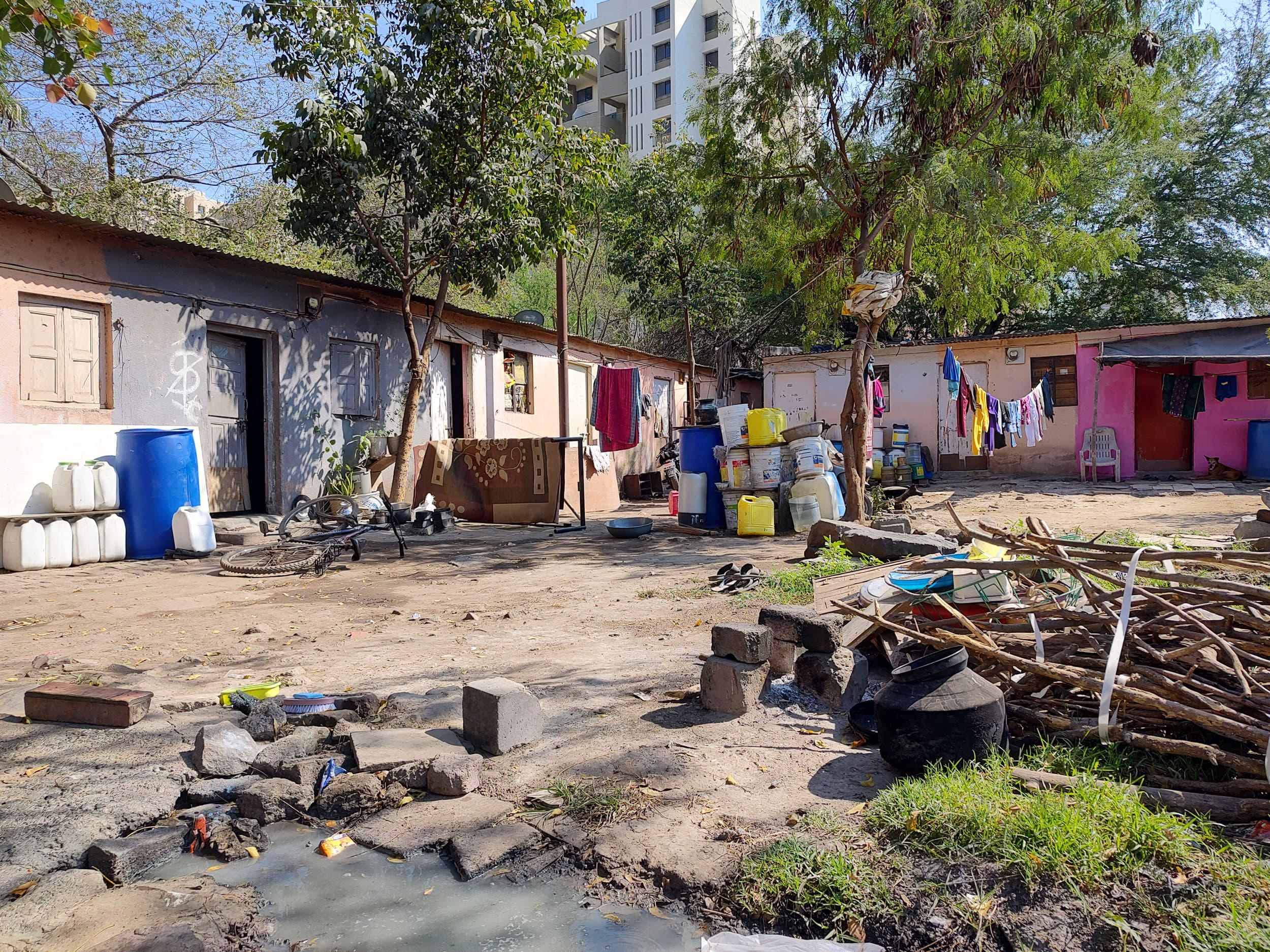 Three brick stoves called chulha sit in one corner of the quadrangle that makes up these single-room homes in Pashan, Pune.