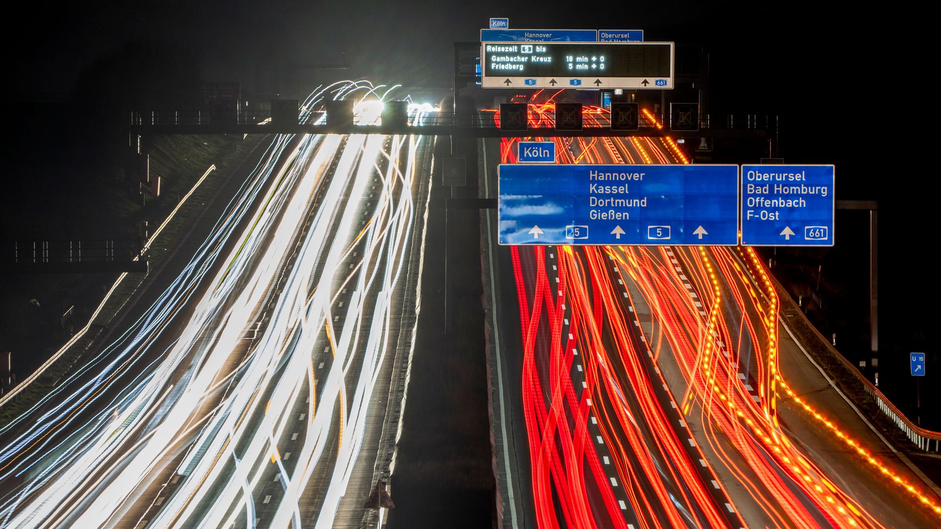 Long exposure photo shows cars and trucks driving on a highway in Frankfurt, Germany, Thursday, Feb. 24, 2022. 