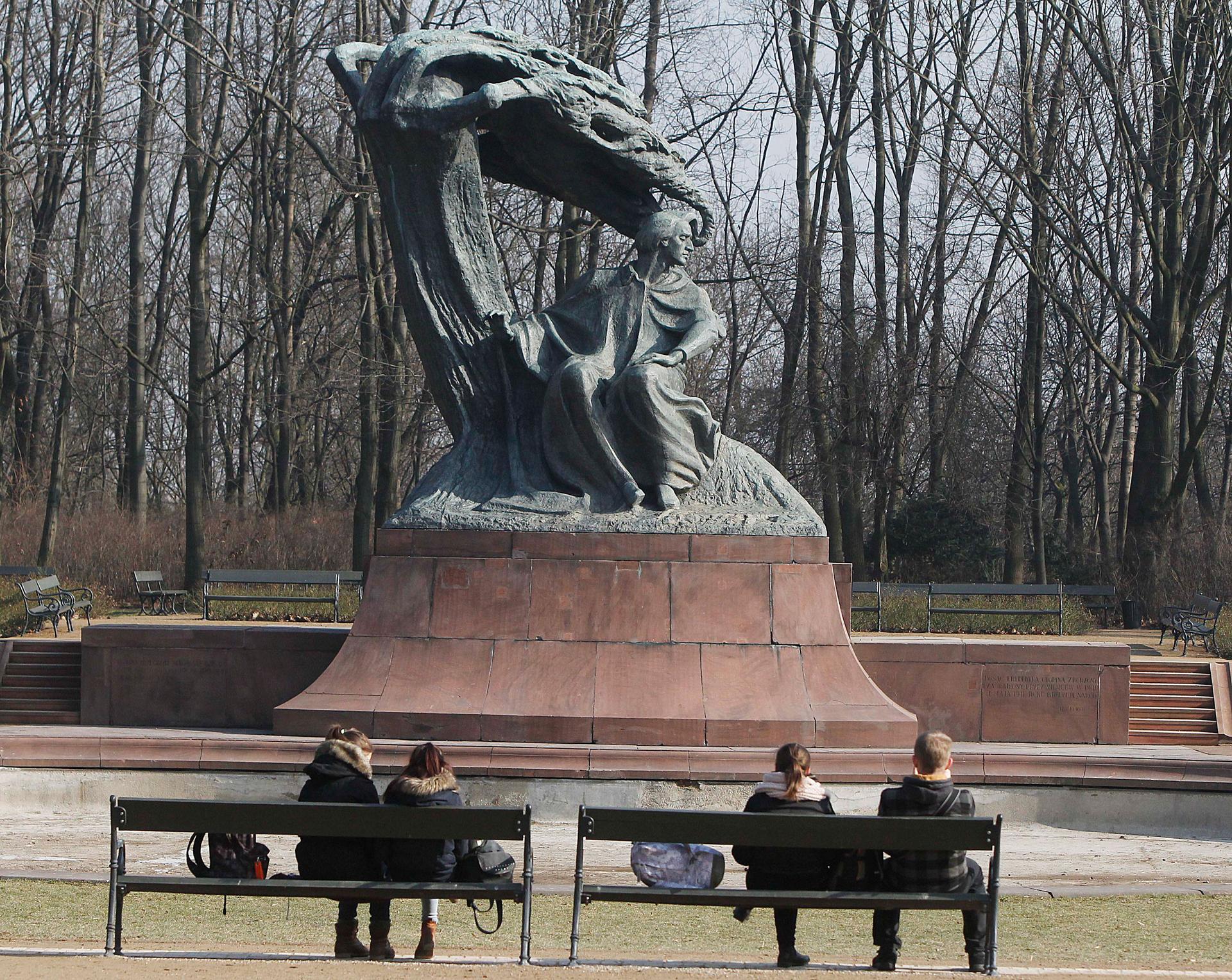 Warsaw residents enjoy an unusually warm and sunny day in the middle of winter next to the monument to Polish composer and pianist Frederic Chopin in the Lazienki Park in Warsaw, Poland, Friday, Feb 20, 2015.